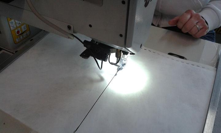 A machine shining a bright light onto paper