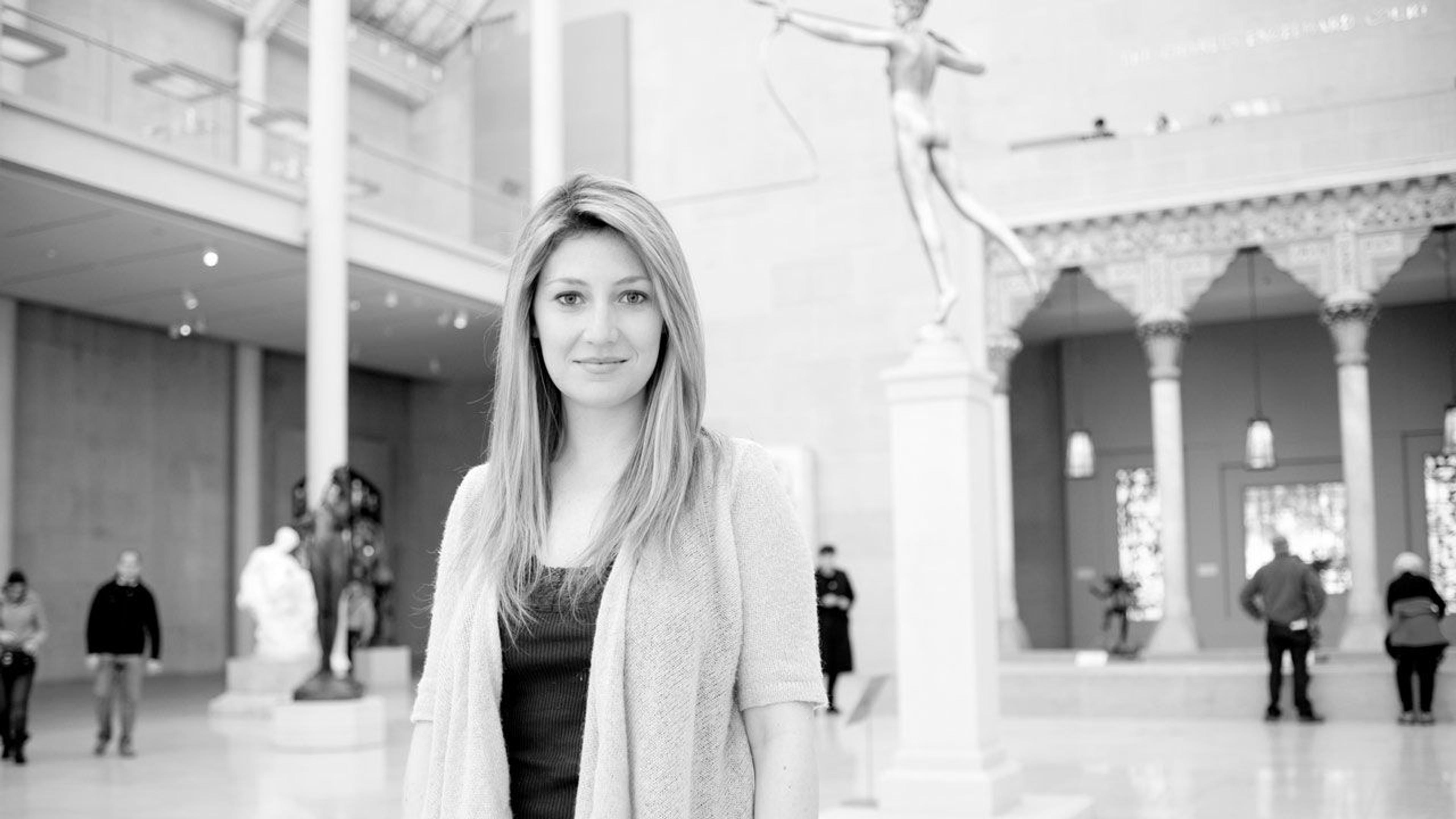 Black and white photograph of editorial assistant Nadja Hansen in The Met galleries