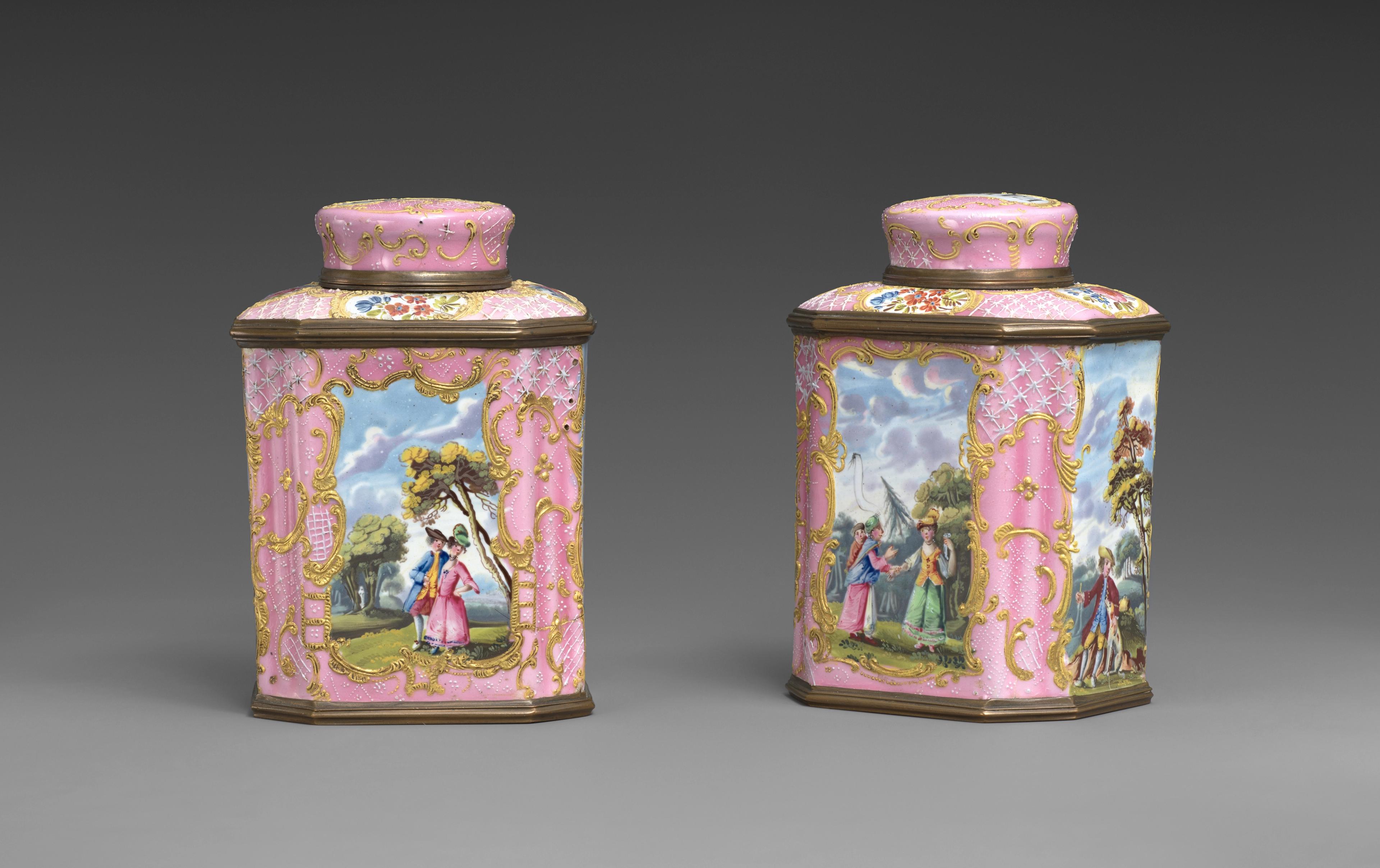 Two ornate pink jars with idyllic scenes of people in nature.