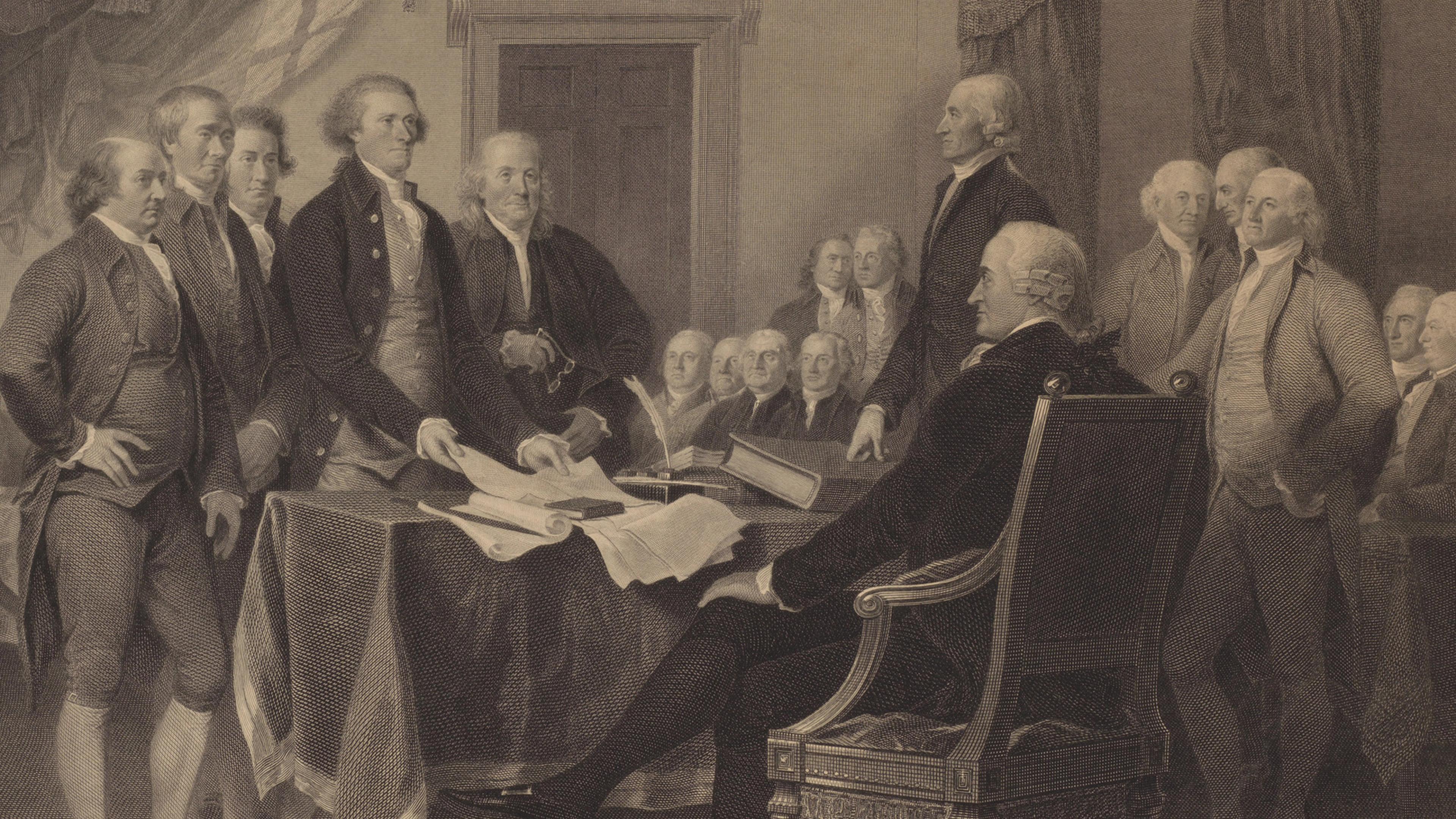 An assembly of formally dressed men gather around a table with a document in a historical setting
