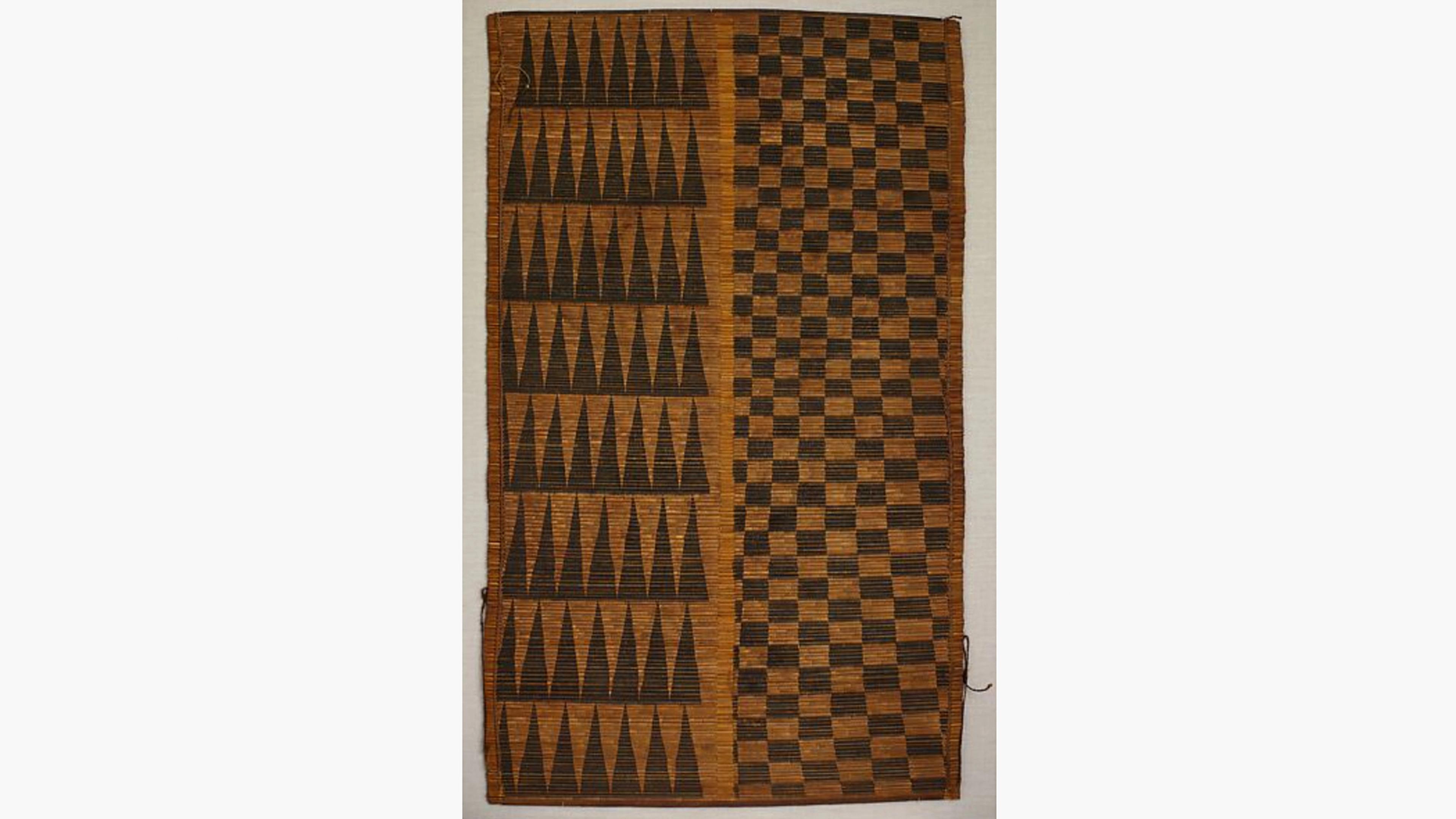 Woven screen divided into two vertical fields of black design on a natural golden brown background