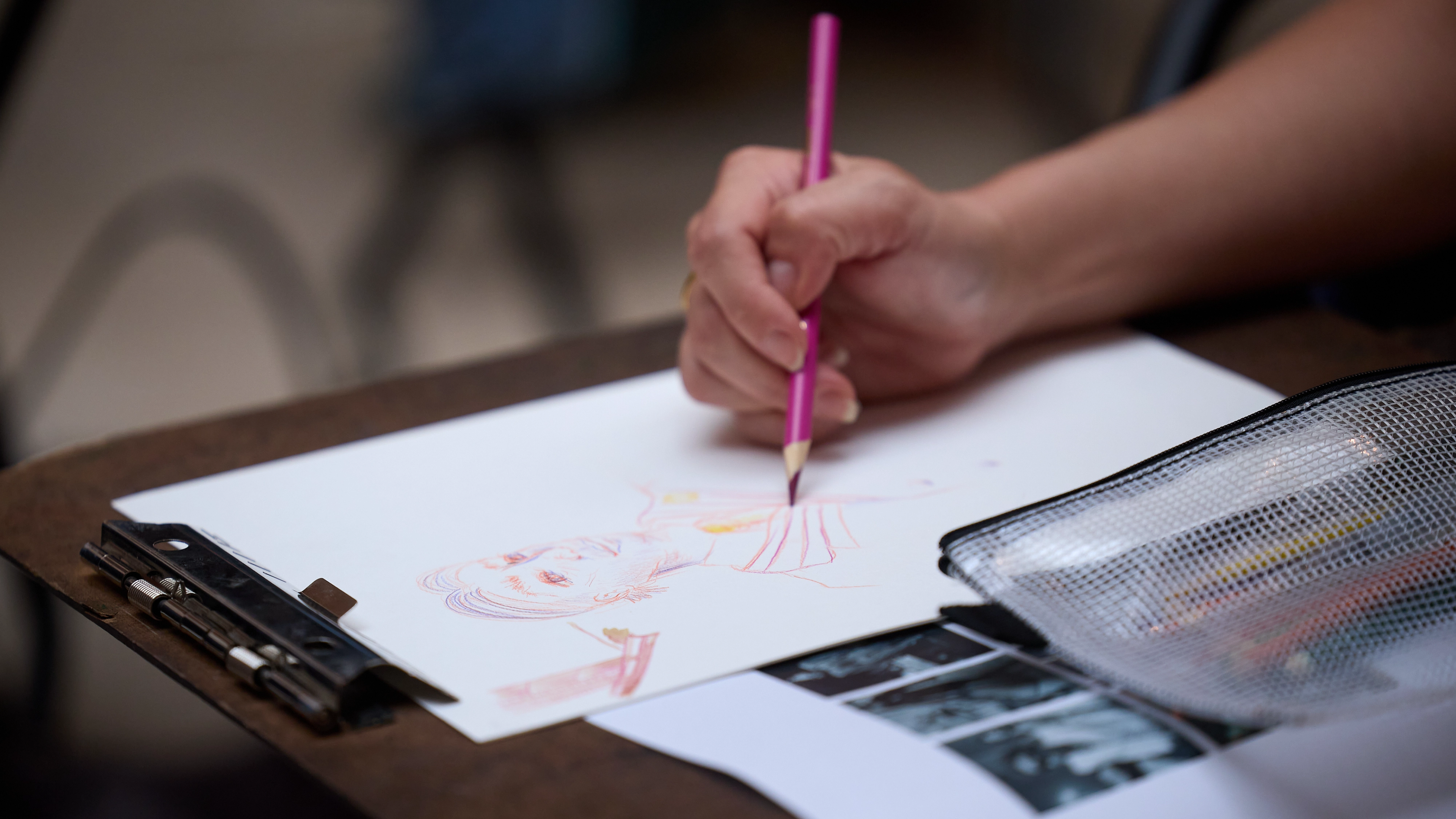 An upclose image of someone drawing. 