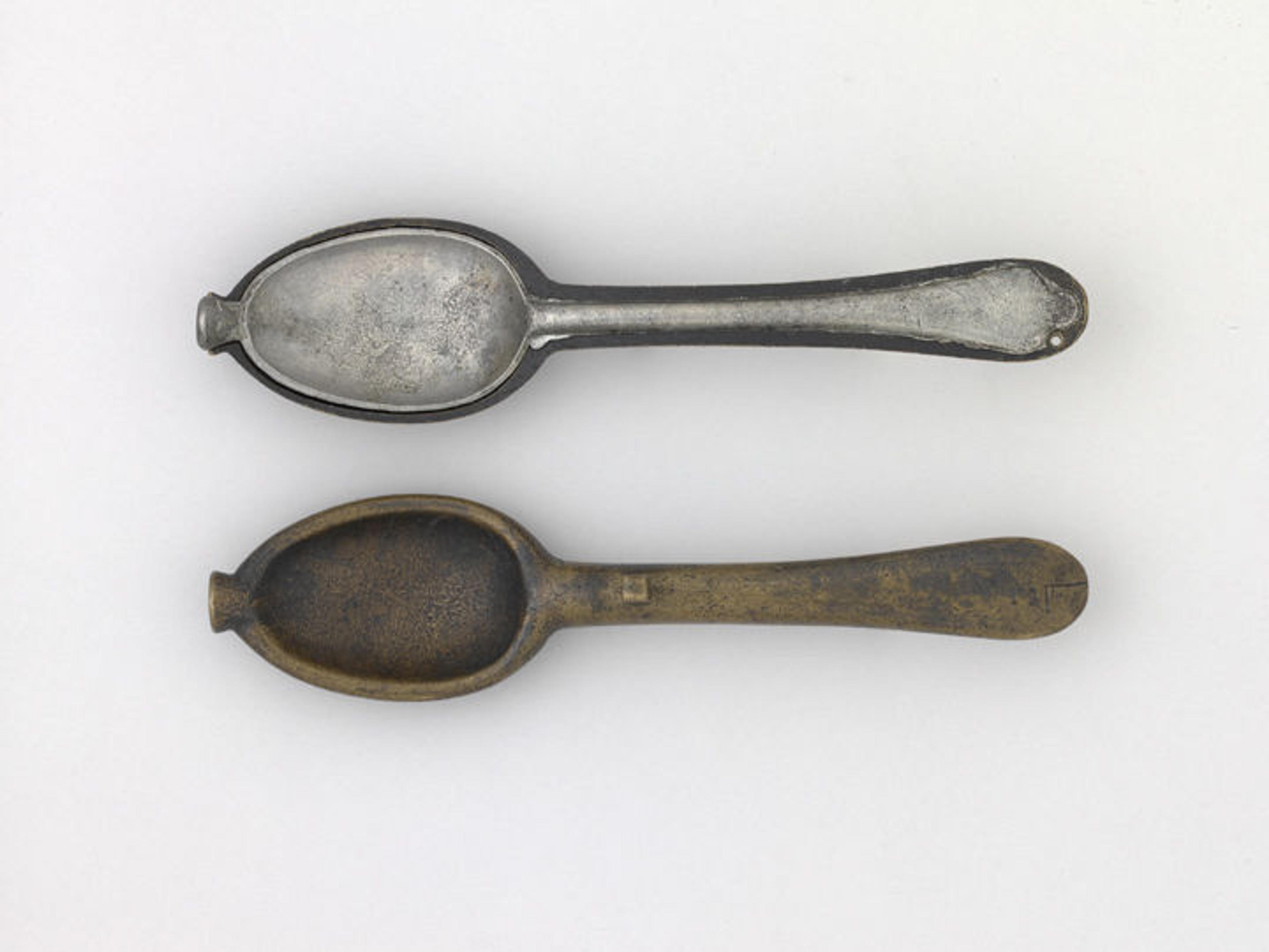 A pewter spoon and its bronze mold from a 1717 pirate's ship