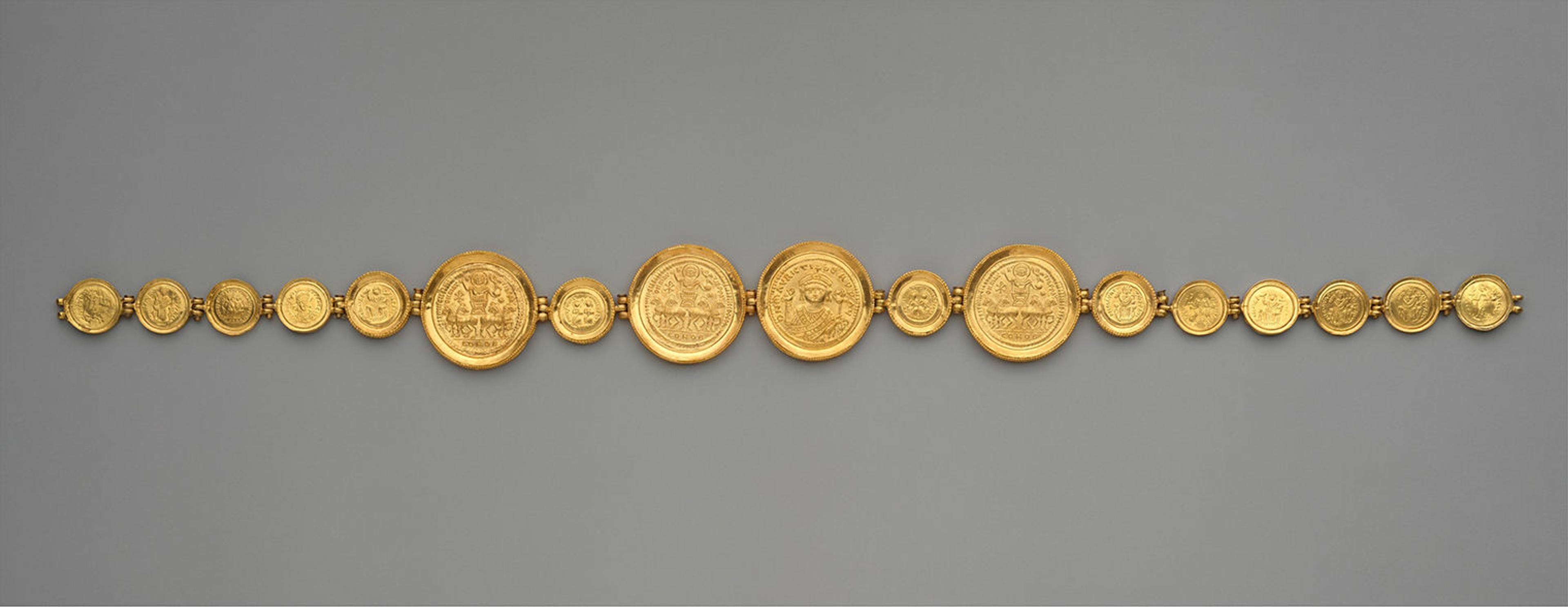 A girdle with seventeen cold coins strung together.
