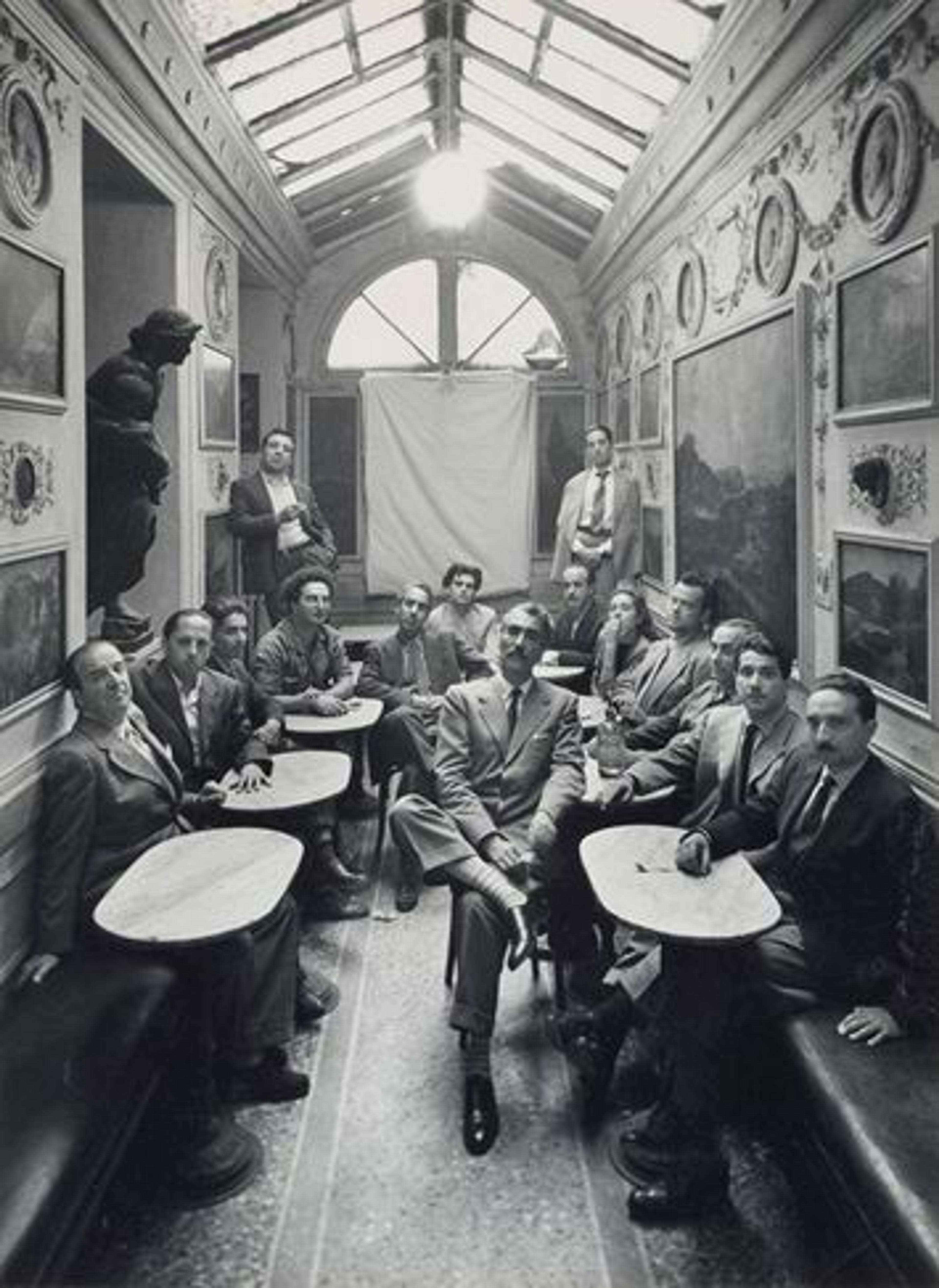 A portrait of artists taken inside the Caffe Greco by Irving Penn