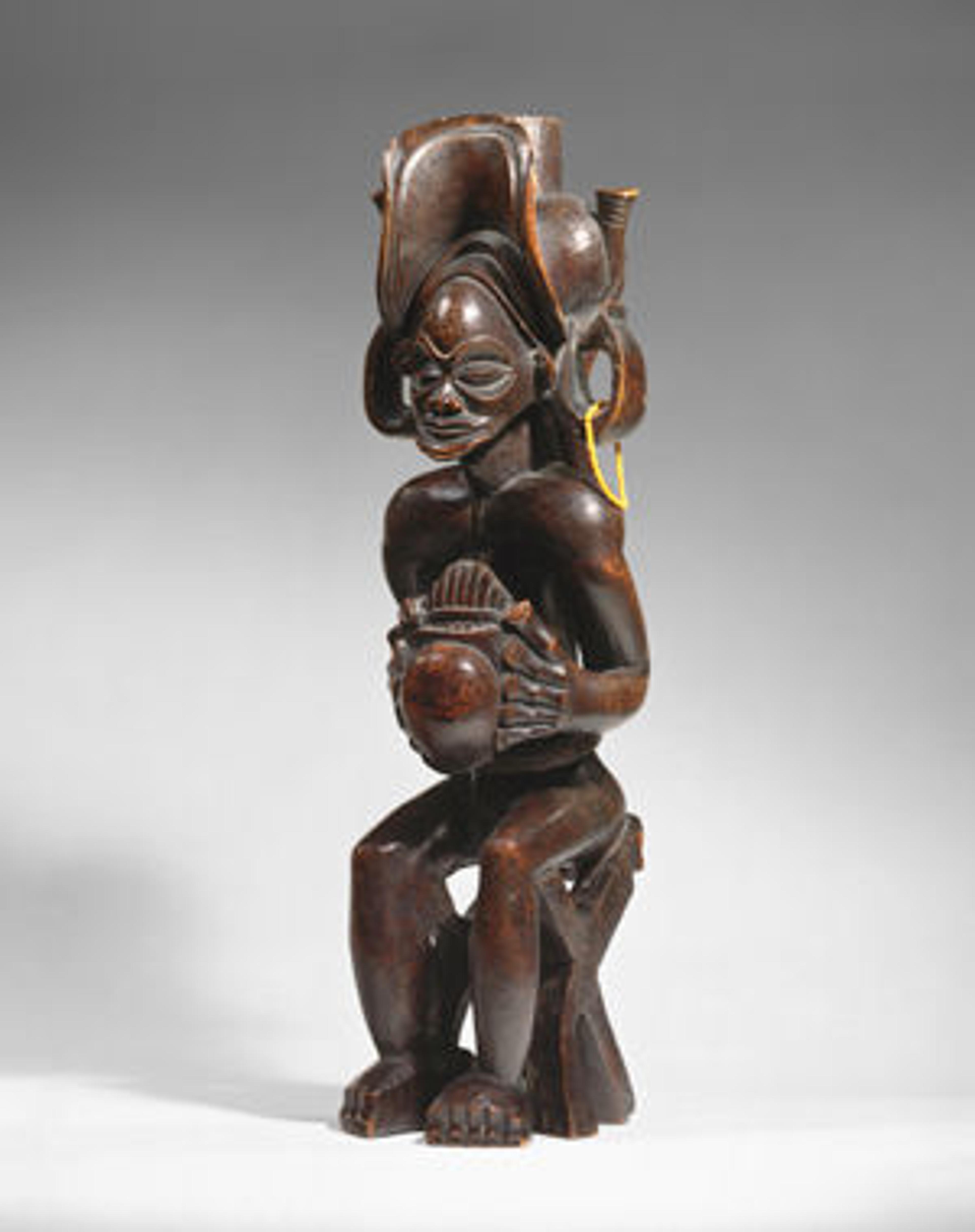 Seated Chief Playing Thumb Piano (Mwanangana). Angola, before 1869