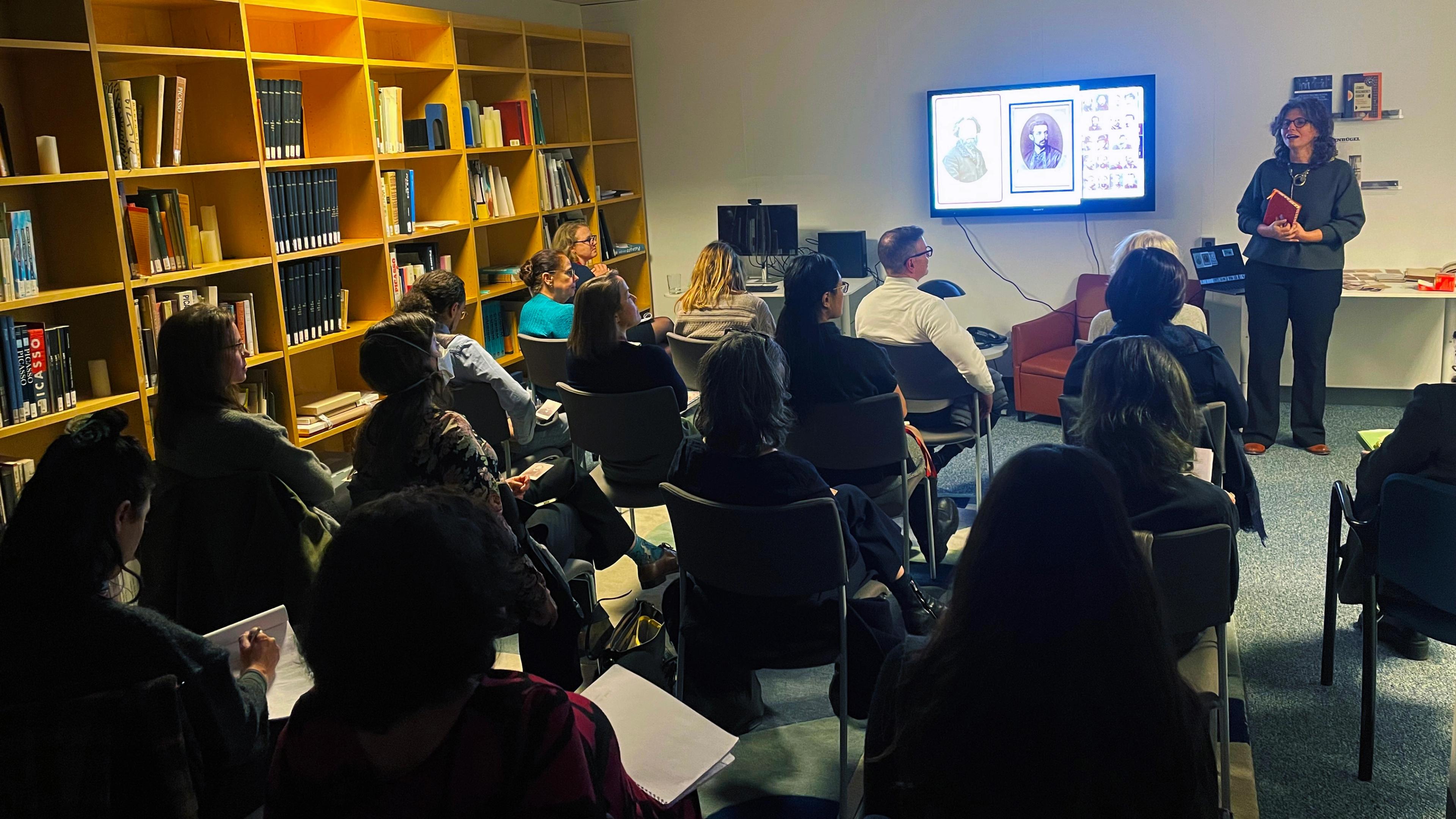 Former senior fellow, Zeynep G., presenting her work in the Lauder Research Center Library with Museum colleagues and invited guests in attendance