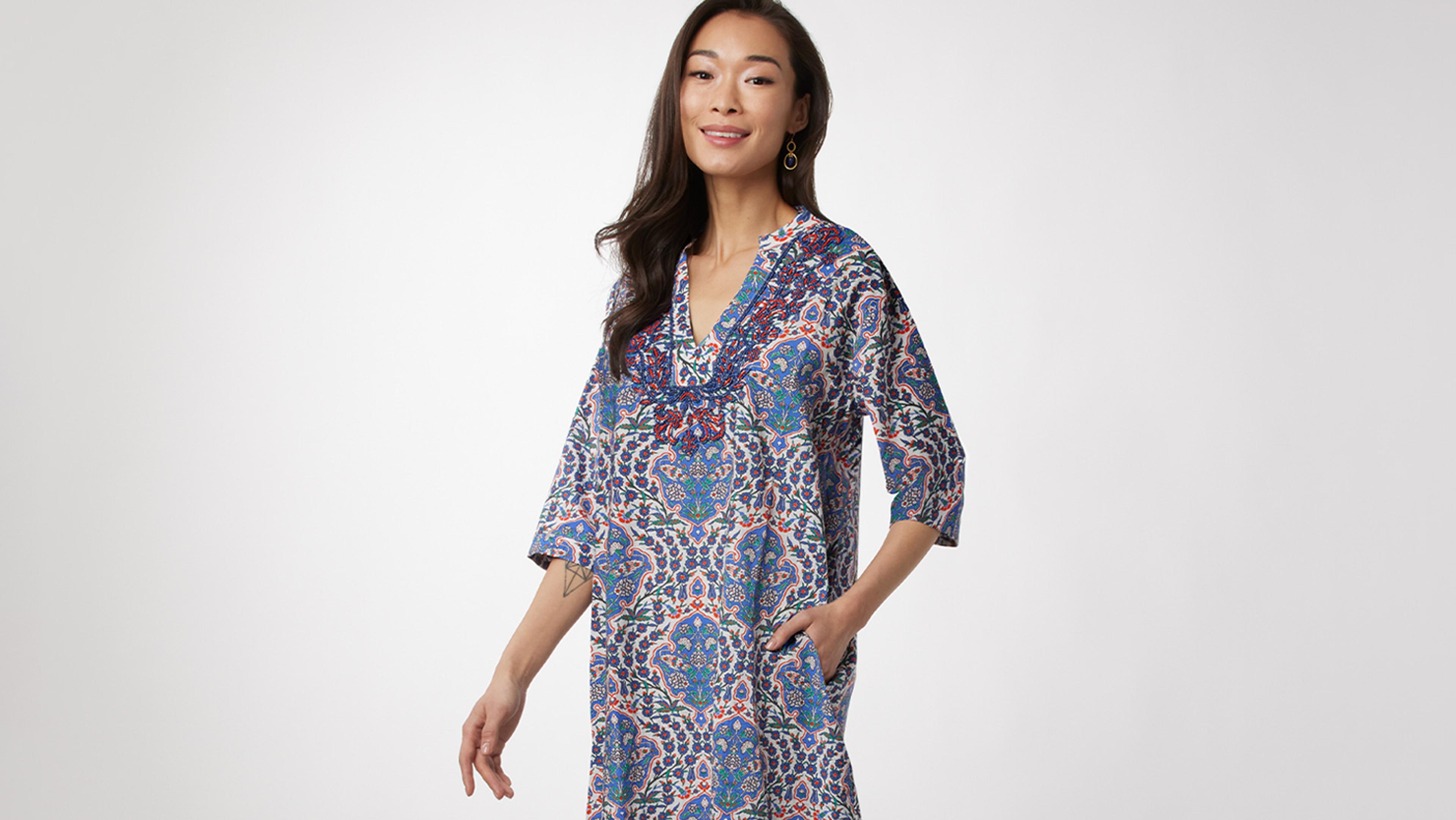 A woman in a patterned caftan.