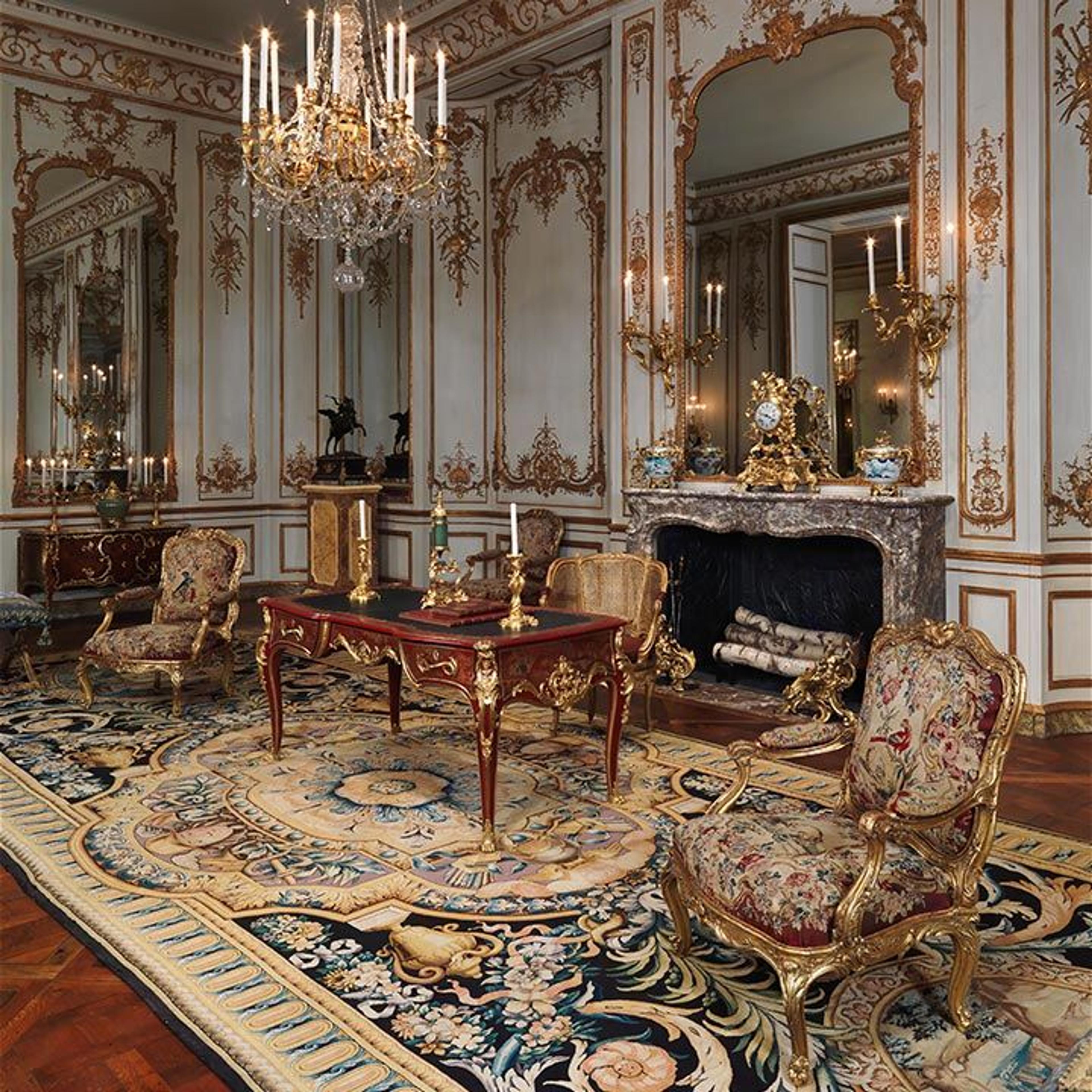 An ornate room with gilded furniture and decorative objects