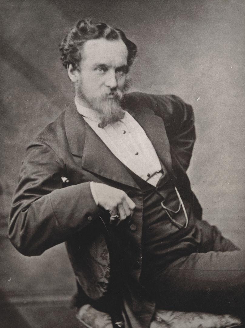 Black and white photo of Jonathan King as young man seated.