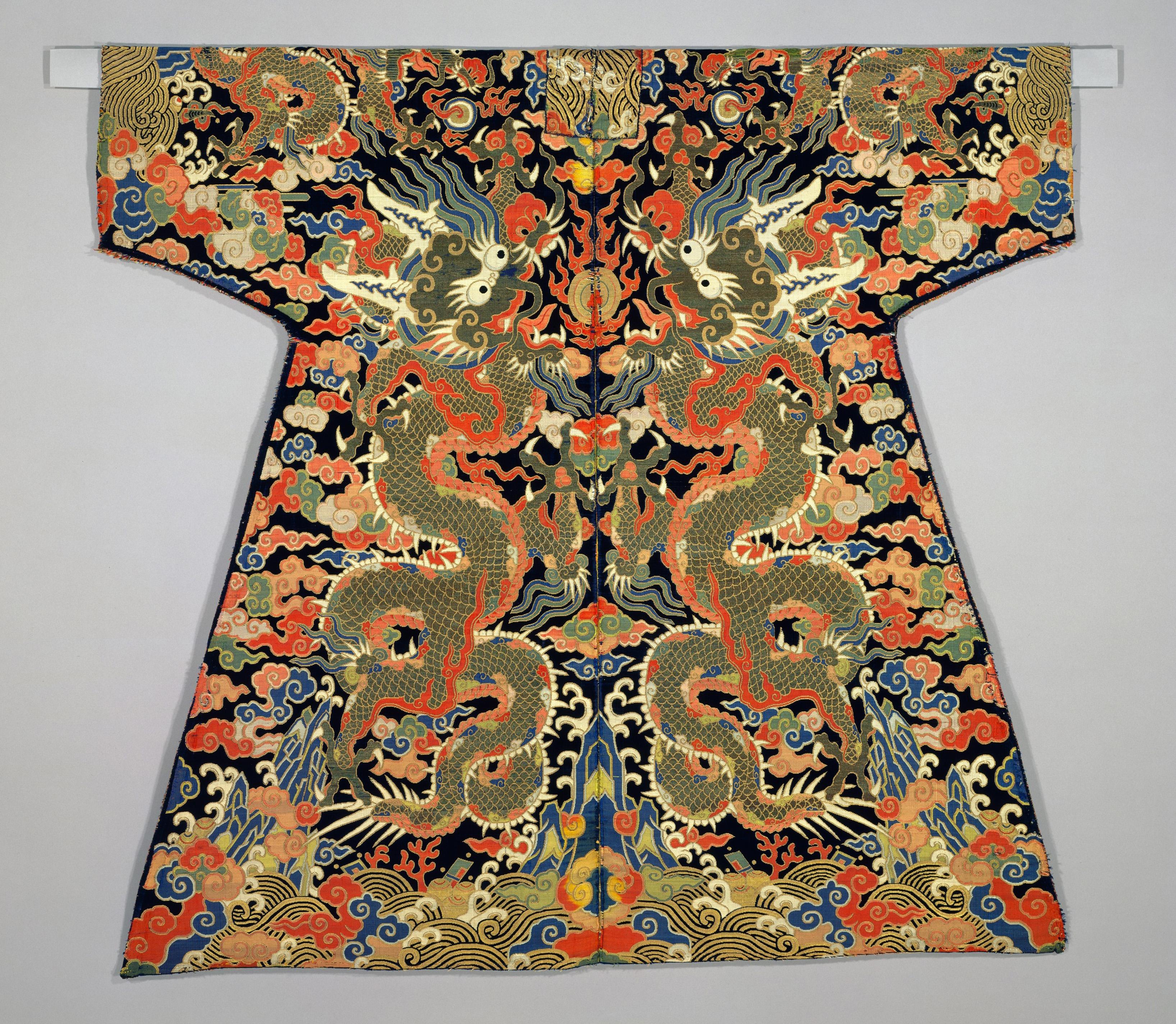 Robe with wide sleeves and a black ground densely embroidered with colorful dragons, phoenixes, clouds, and waves in gold, blue, red, and cream thread.