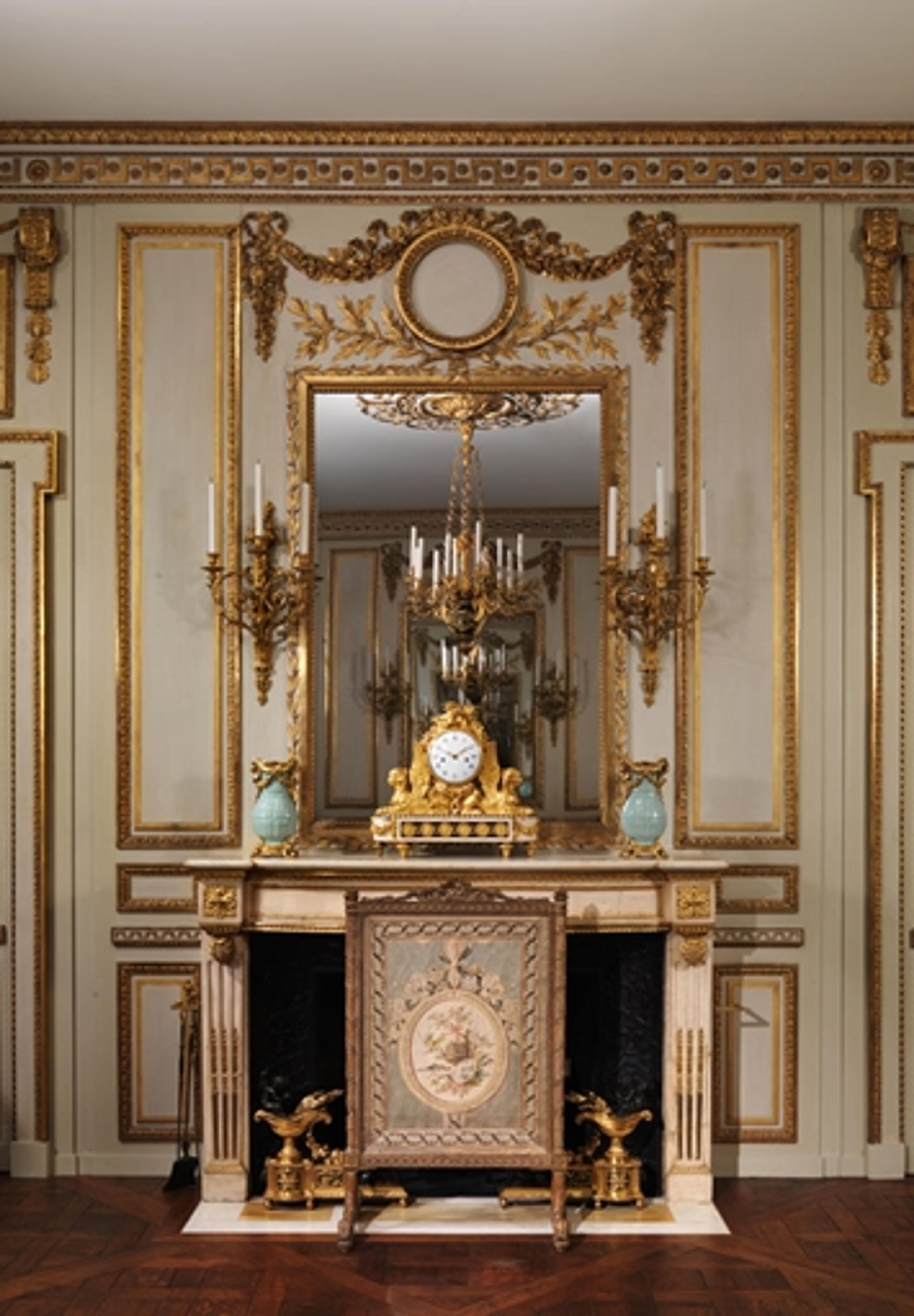 Installation view of the boiserie from the Hôtel de Cabris at The Met (view of the chimneypiece wall, fire screen, and clock)