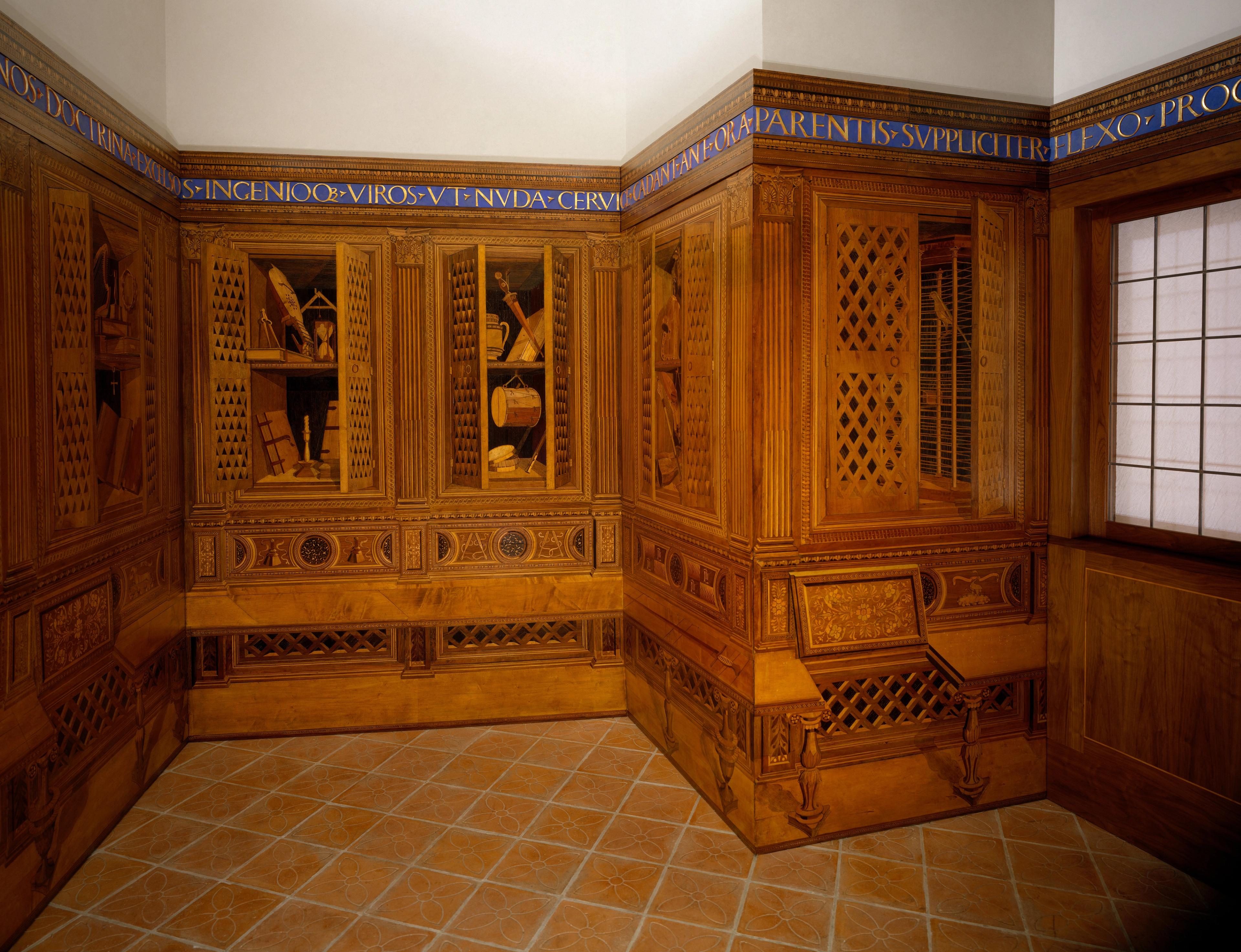 View of a room with detailed wood inlays, part of the Studiolo from the Ducal Palace in Gubbio.