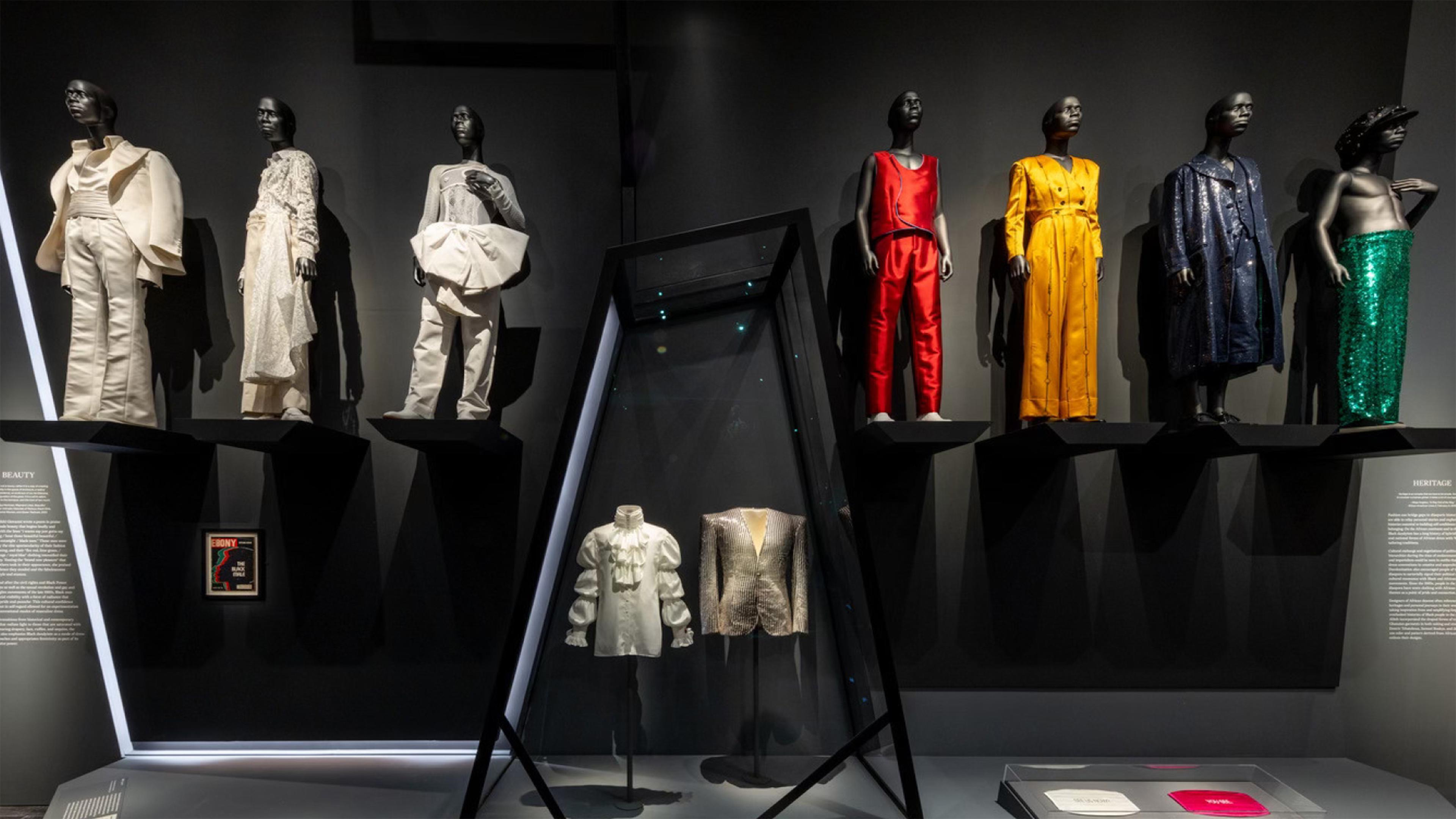 Various mannequins standing up right wearing special designed suits.