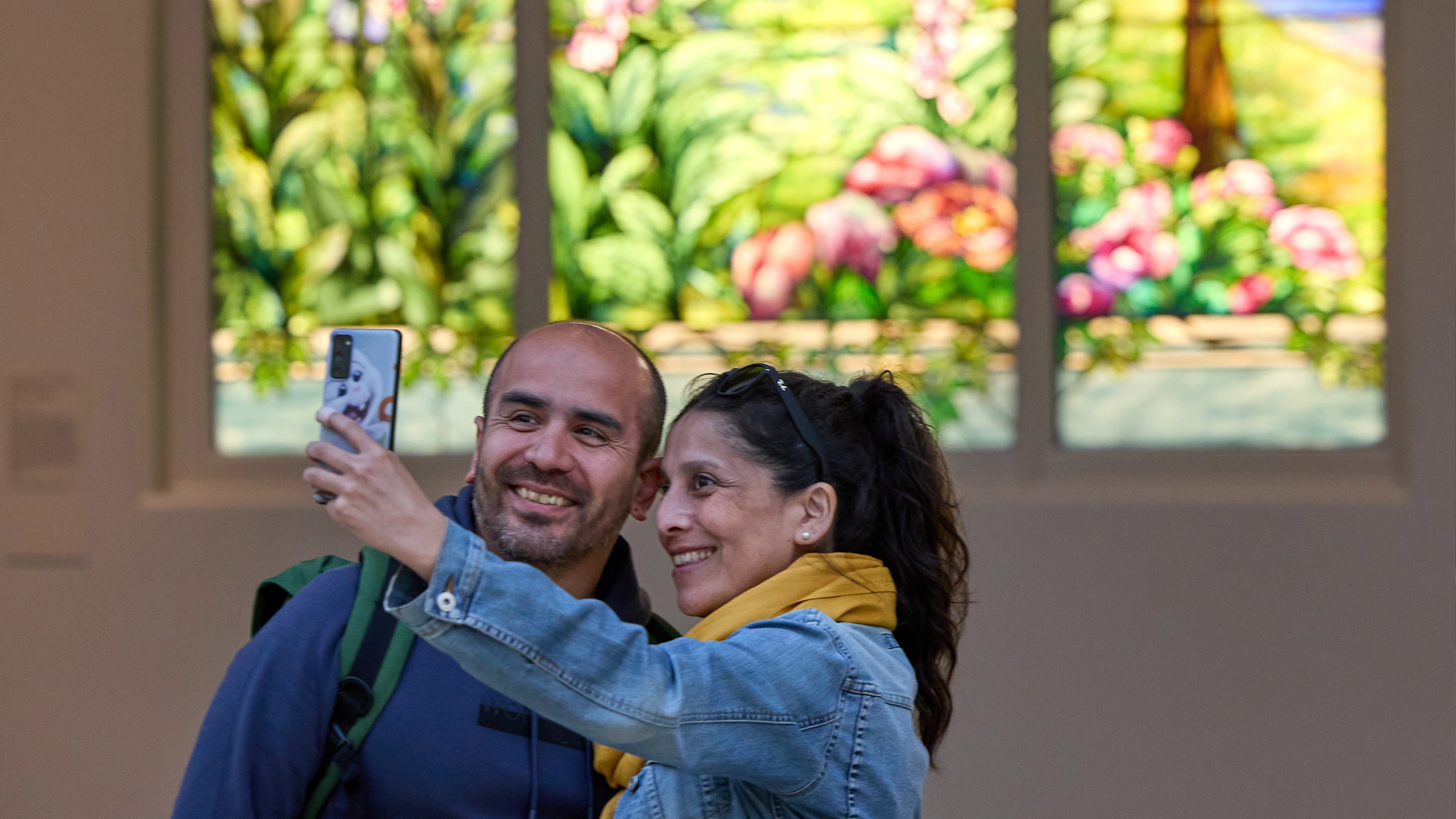 Couple taking a selfie in The American Wing 