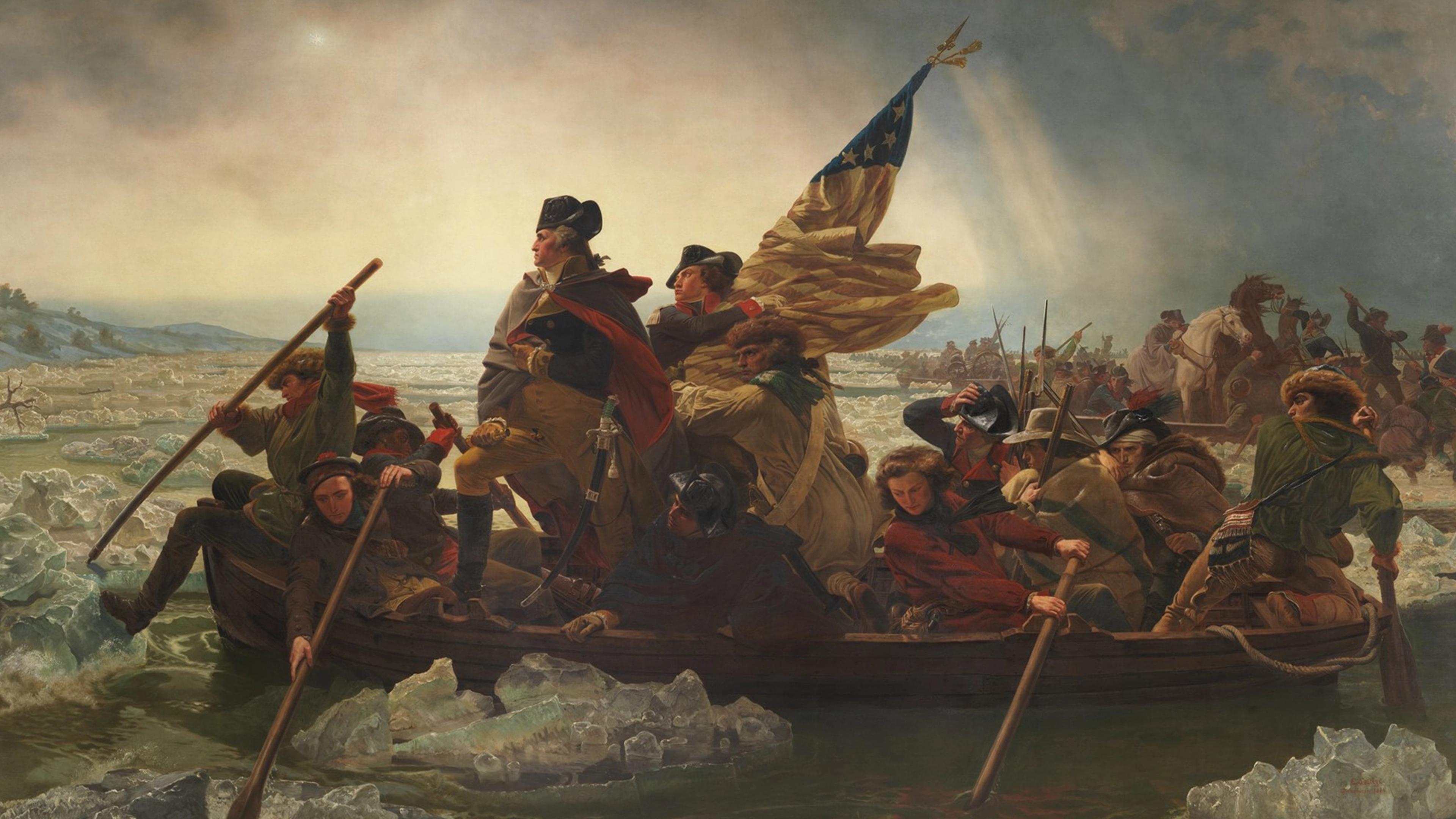 A group of determined men, bundled in winter clothing, row a wooden boat through icy waters. One holds a flag; another stands, gazing forward 