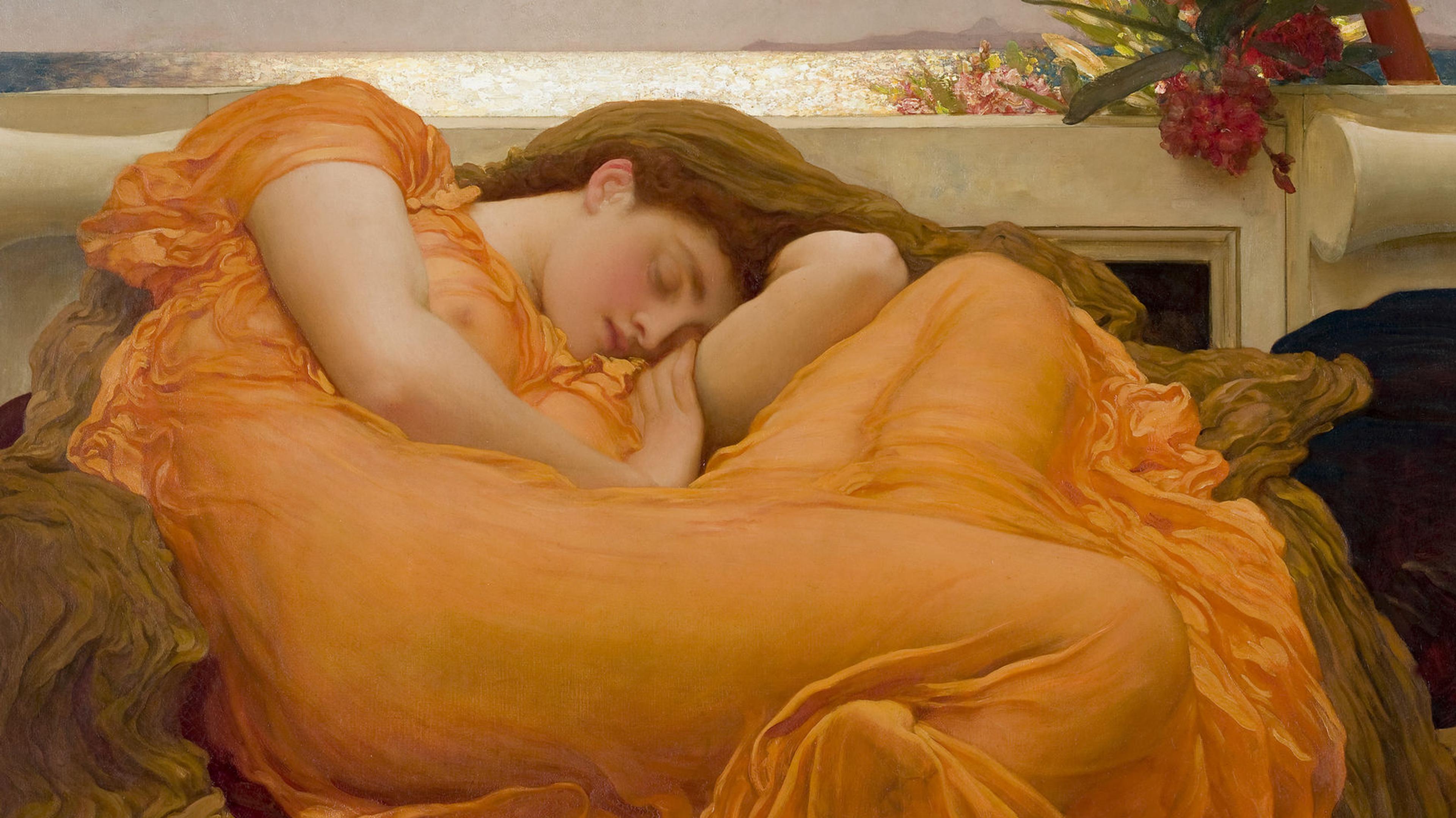 Realistic painting of a white women with reddish hair sleeping in a curled up position on a large comfortable looking surface that has maroon red and brown clothe on it. The women is wearing a broad orange dress that is fairly transparent so the outline of her body is prominent. Behind her is a wall and behind that wall is a sunlit reflective body of water with a clear sky. A bright red flower creeps above the wall right above her.