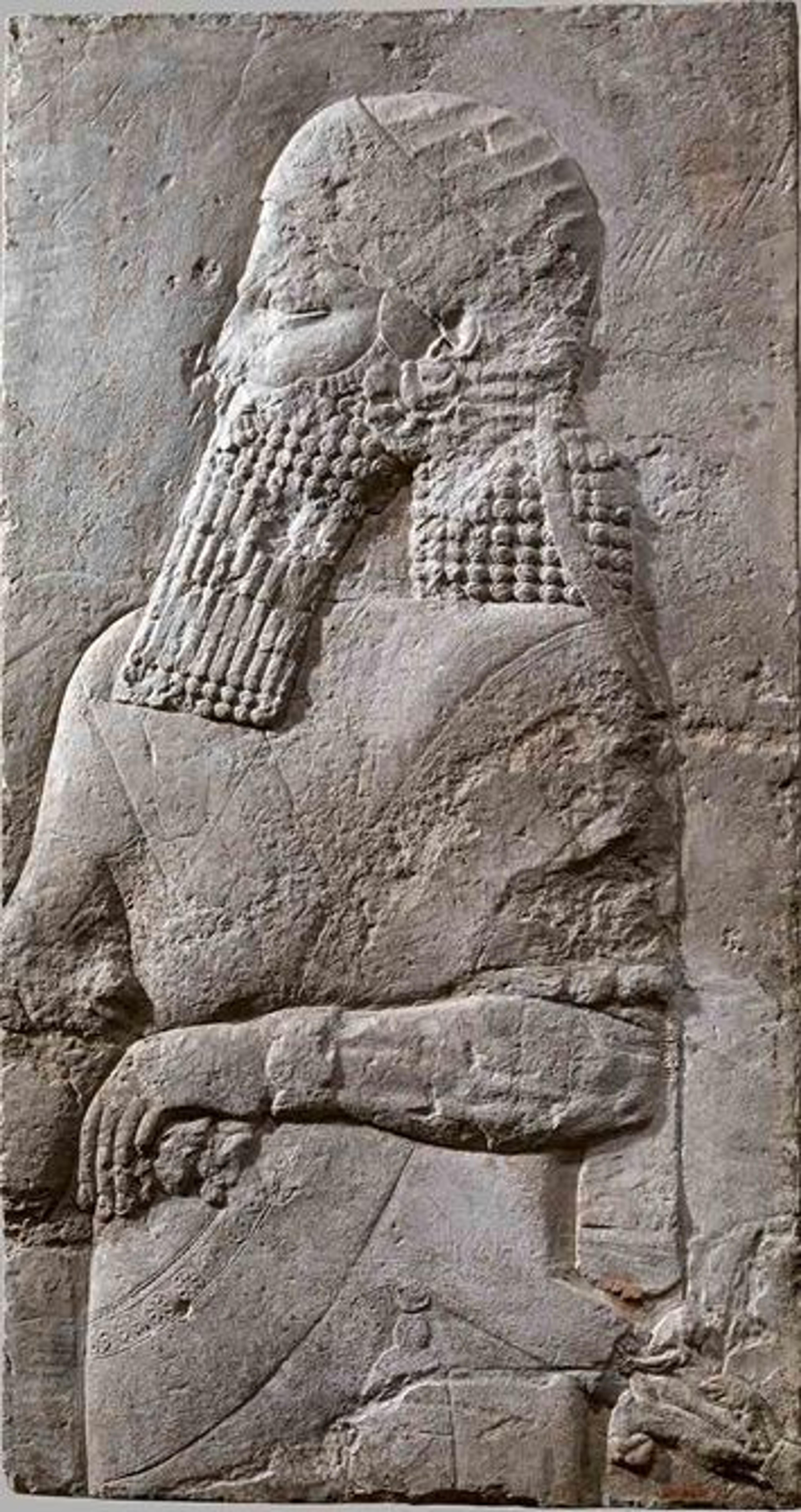 Relief sculpture showing Assyrian prince in profile view