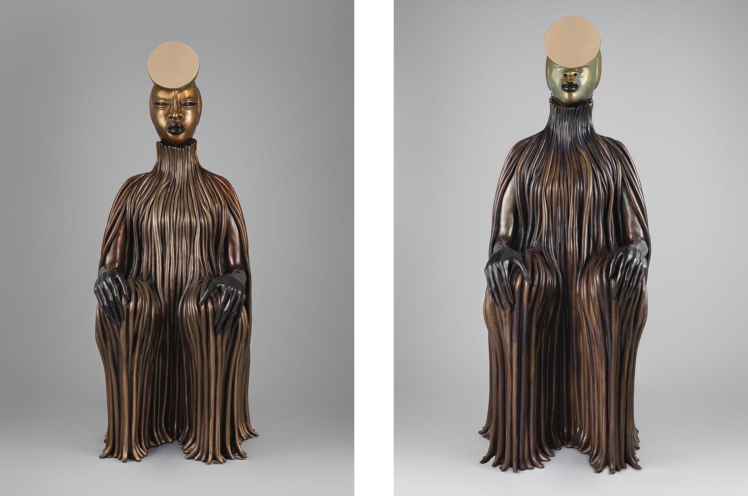 Two patinated bronze sculptures of seated women with coils and mirrored surfaces