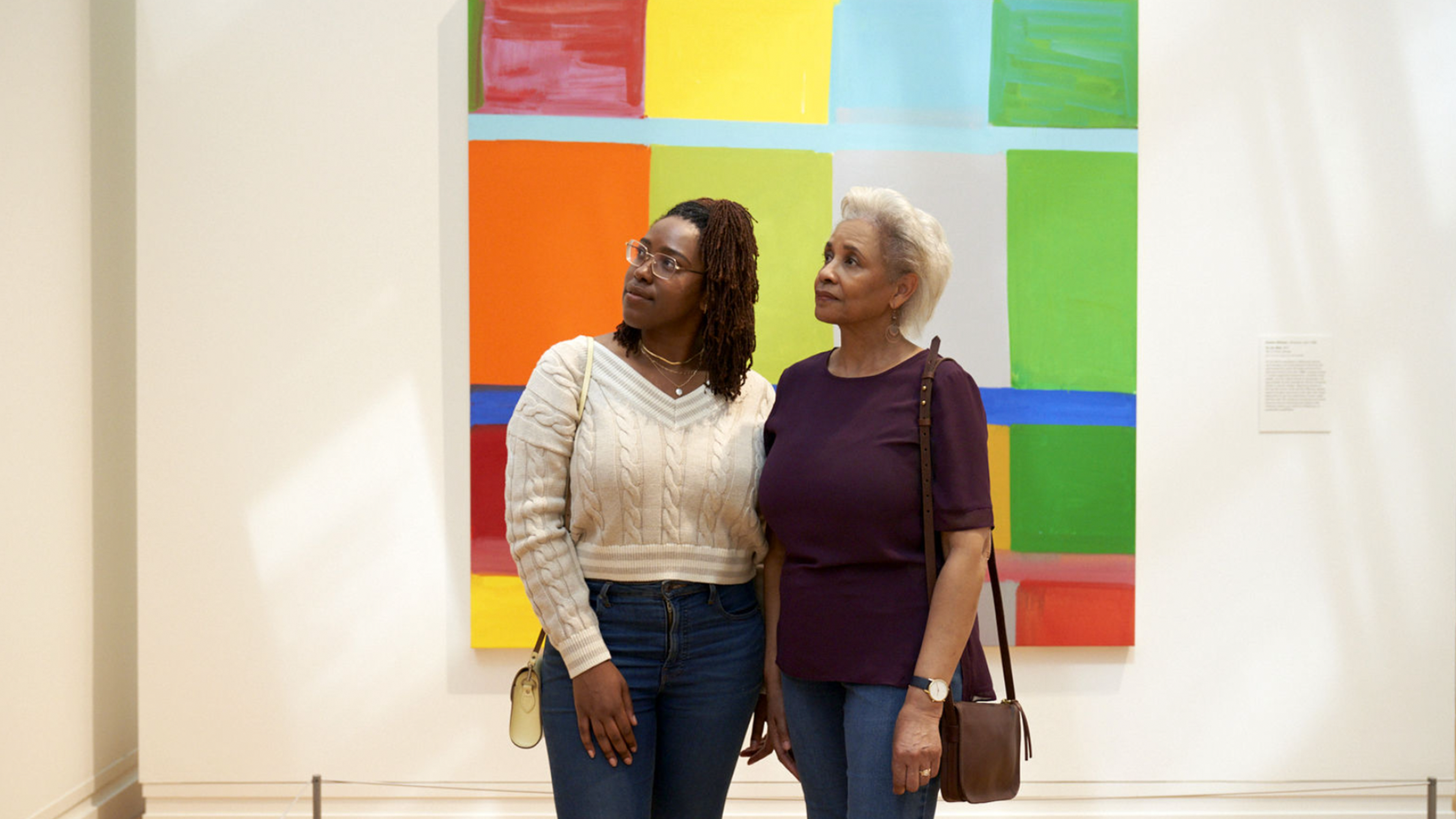 People looking at artworks at The Met.