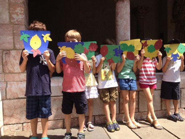 Day campers displaying their craft projects