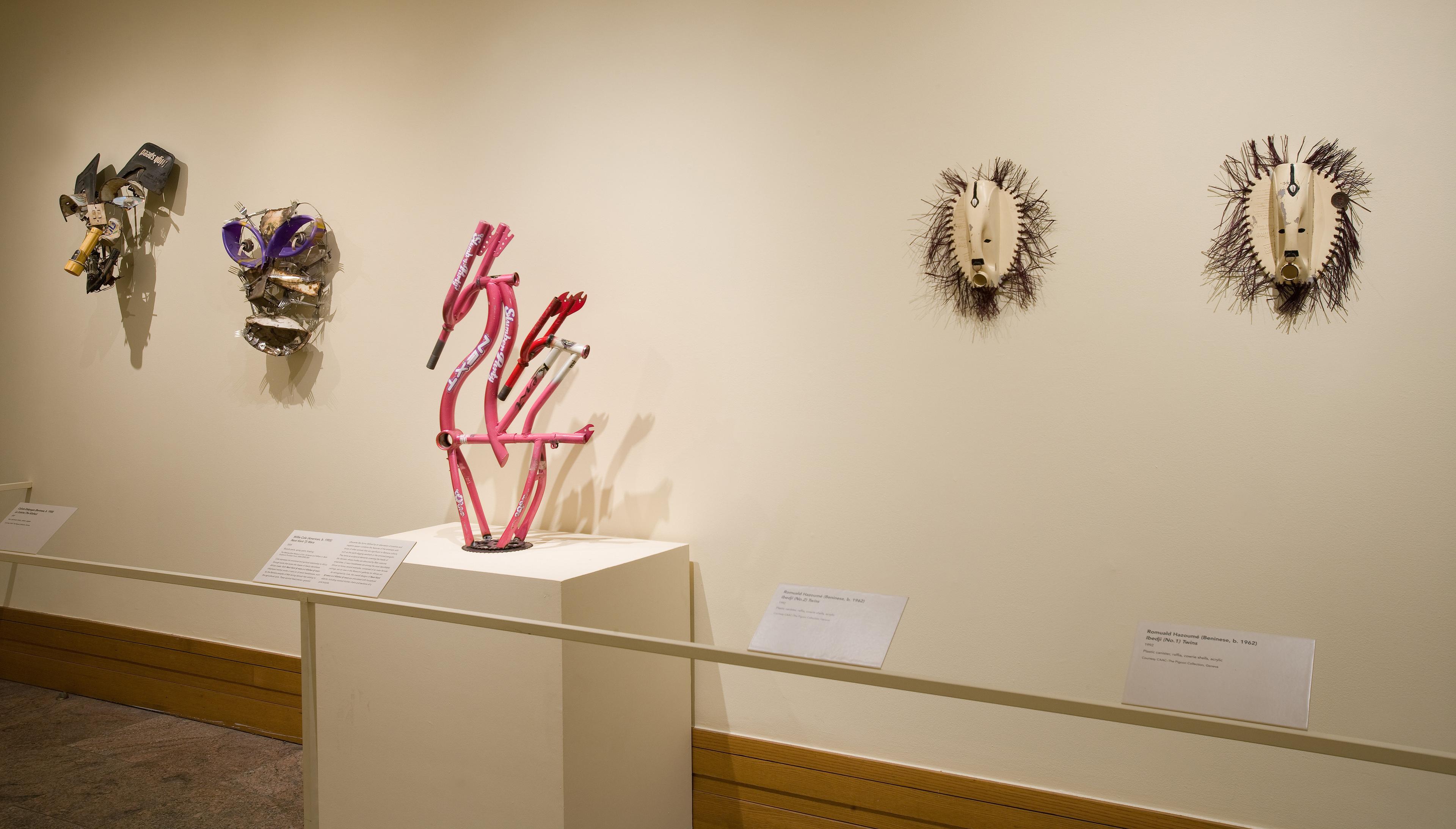 Gallery view of five masks on display