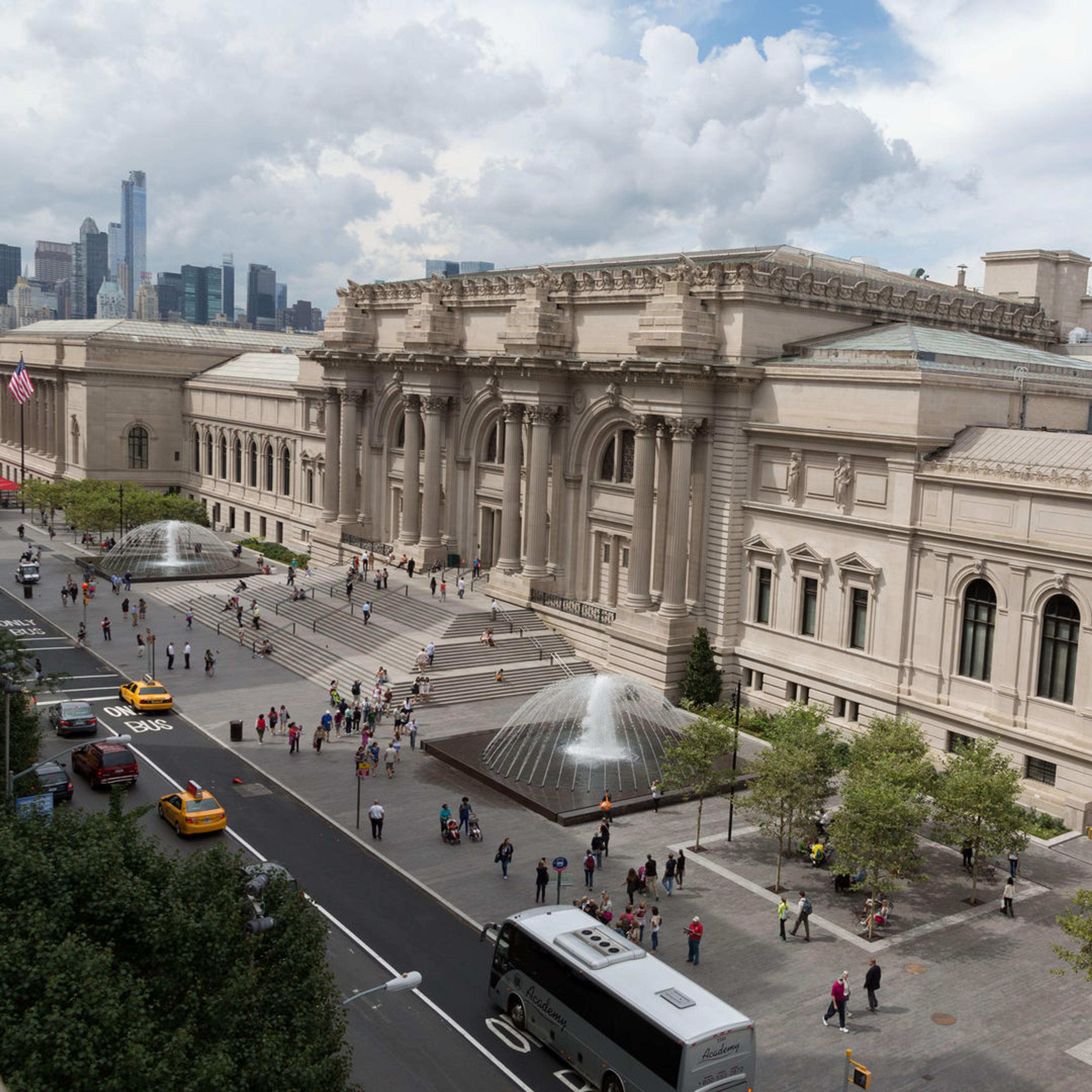 Photograph of The Metropolitan Museum of Art facade against a cloudy sky.