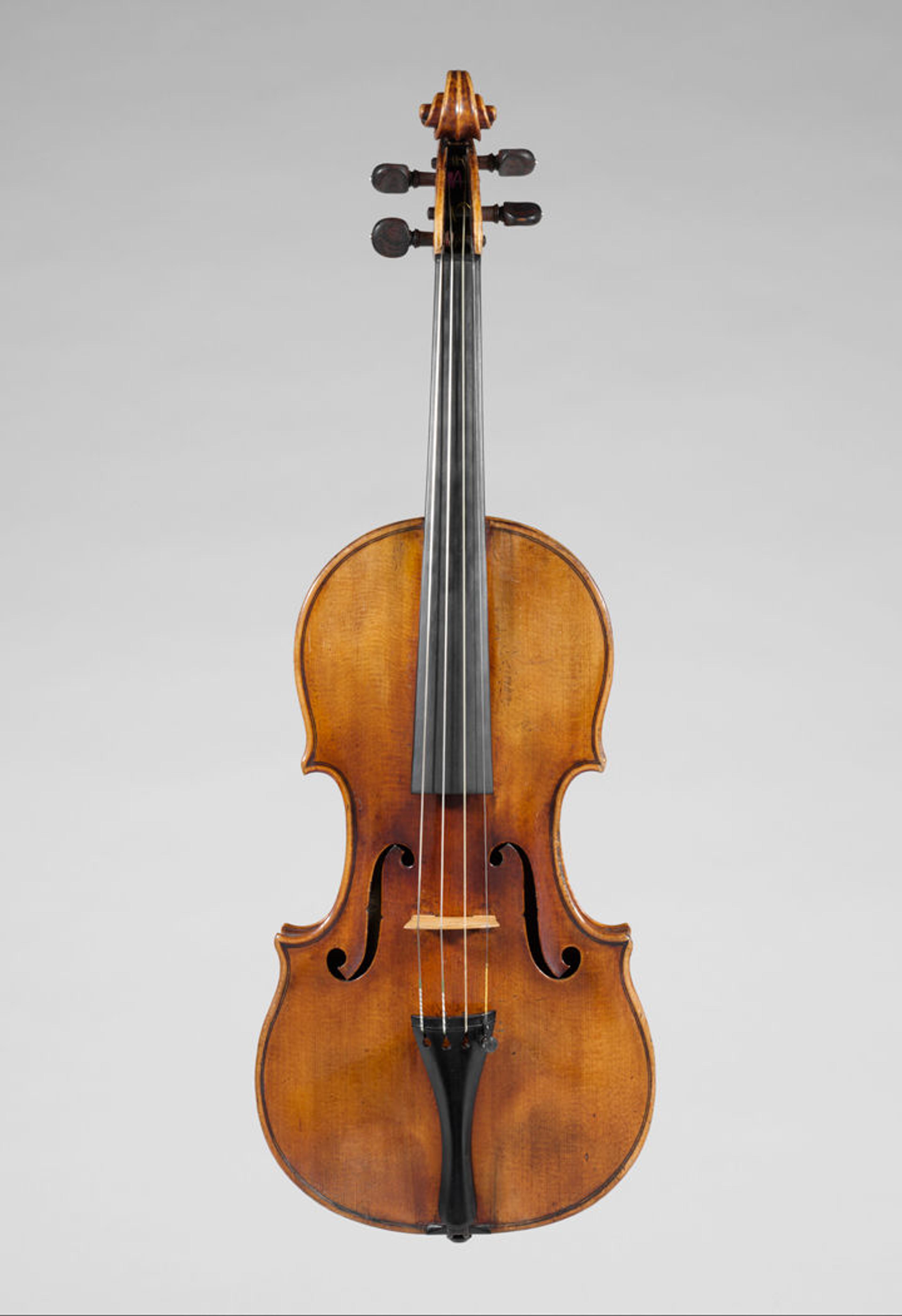 Picture of a golden-brown violin made by Antonio Stradivari