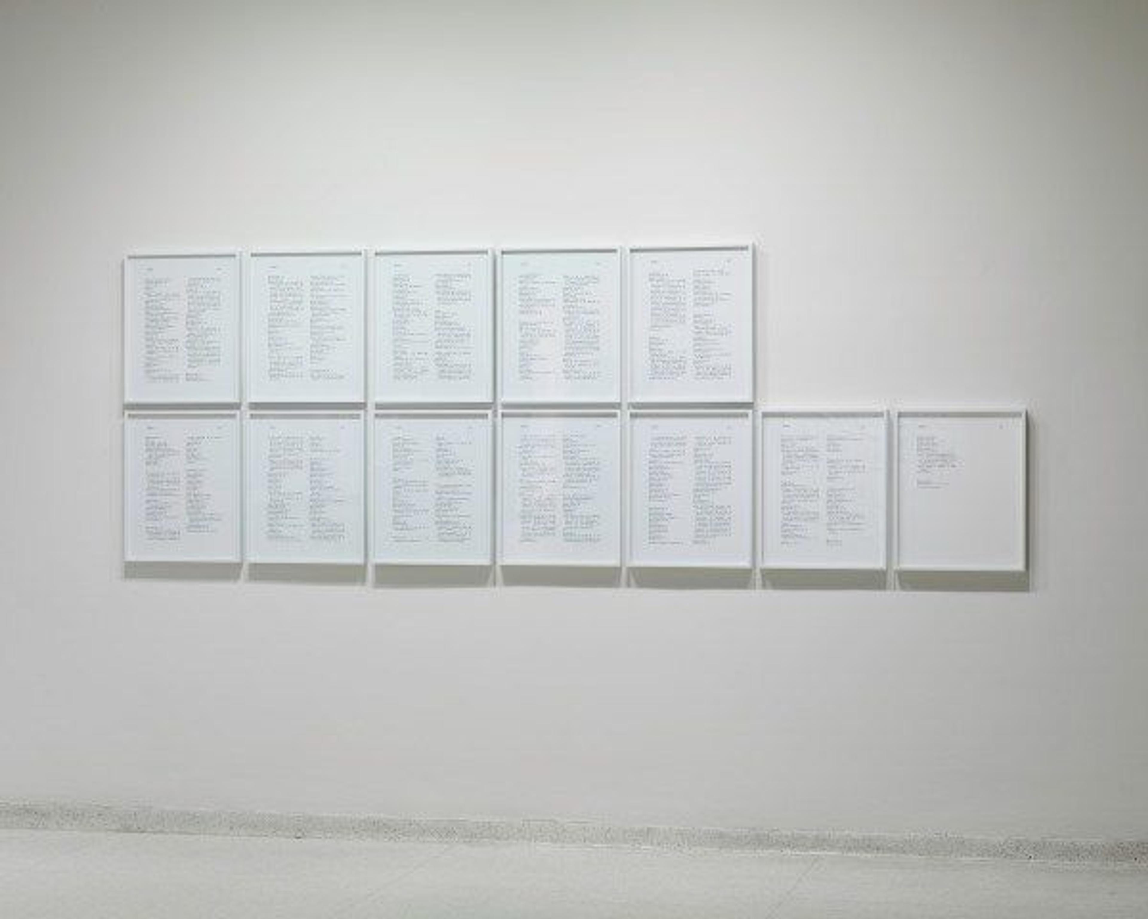 Twelve chromogenic prints showing lines of text hung in two lines on a wall, with five works on top and seven on the bottom