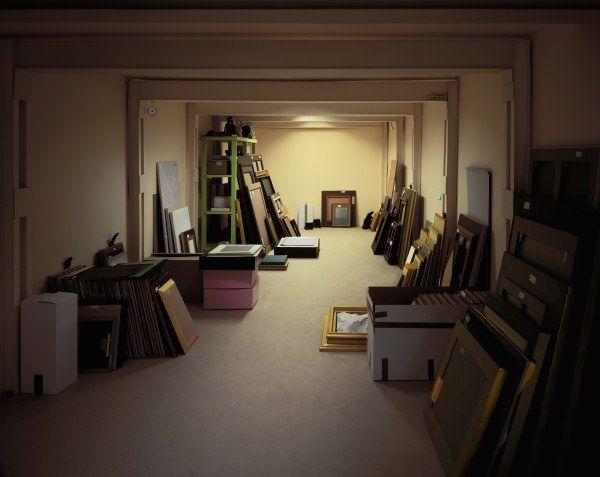 A color photograph of a paper construction of a storage room containing art