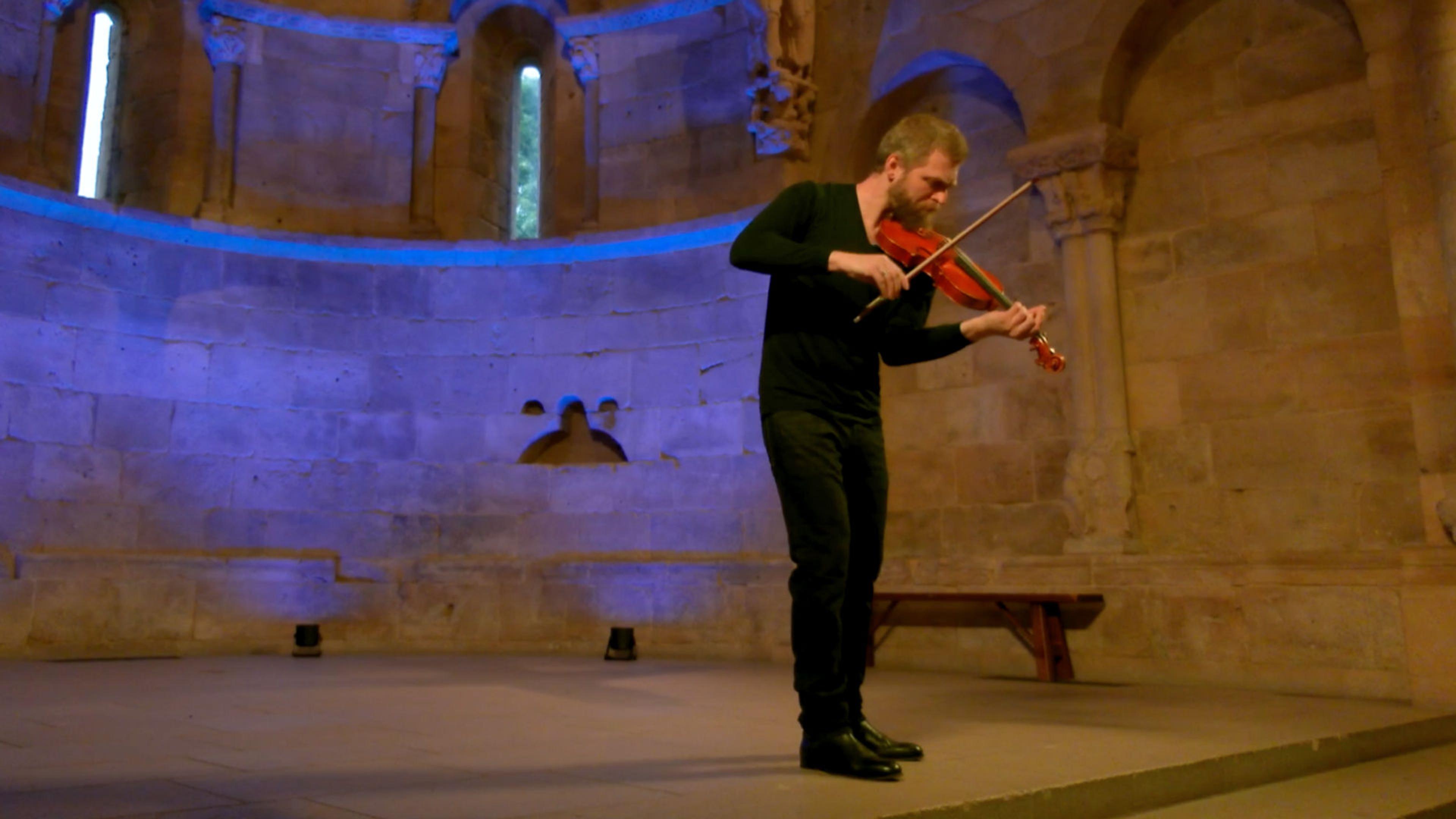 Johnny Gandelsman performing the violin in Fuentidueña Chapel at The Met Cloisters.