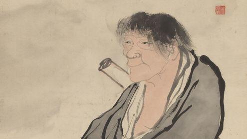 A smiling figure sits with a scroll peeking behind their back