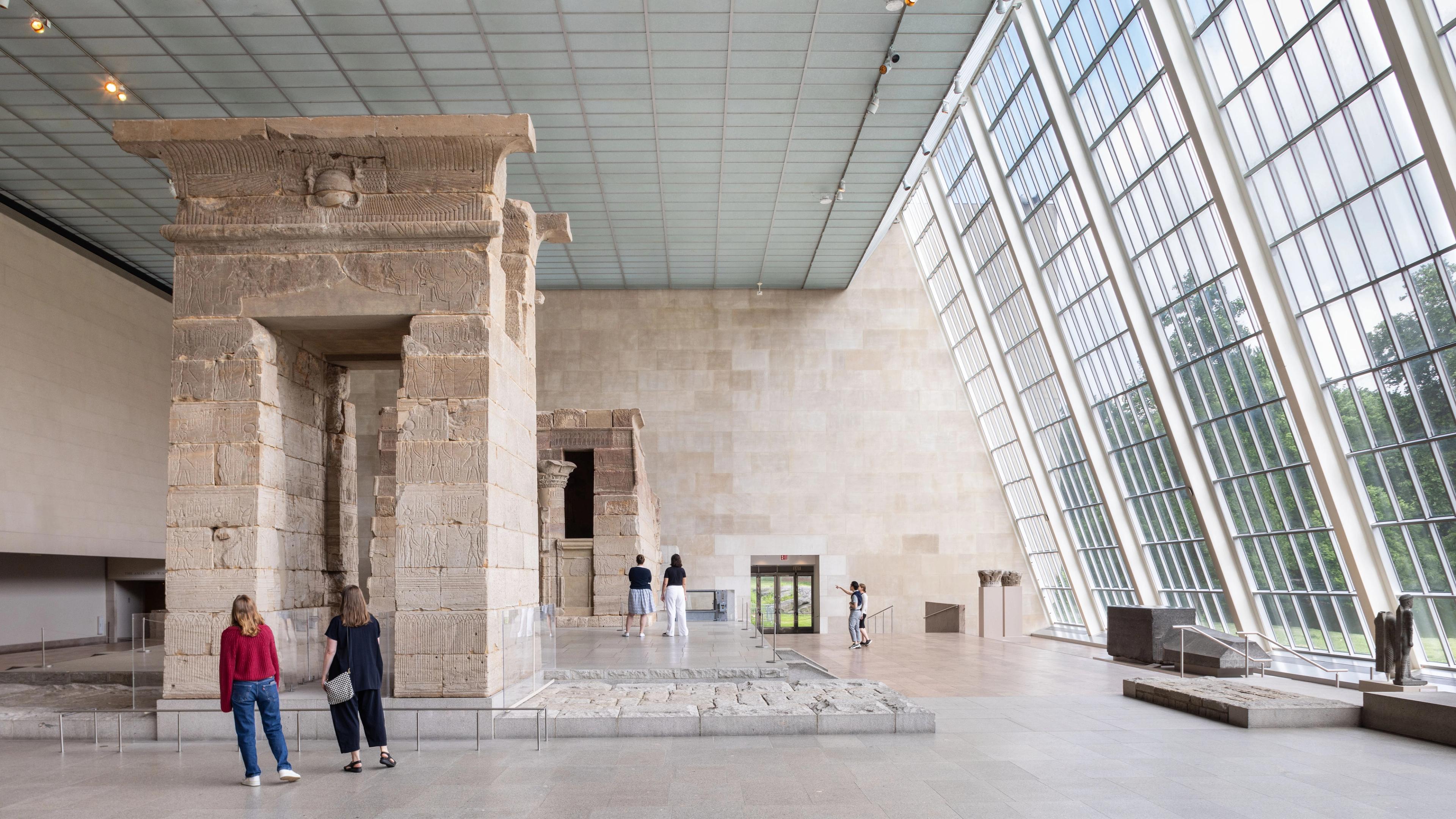 People explore the Michael C. Rockefeller Wing at The Met.