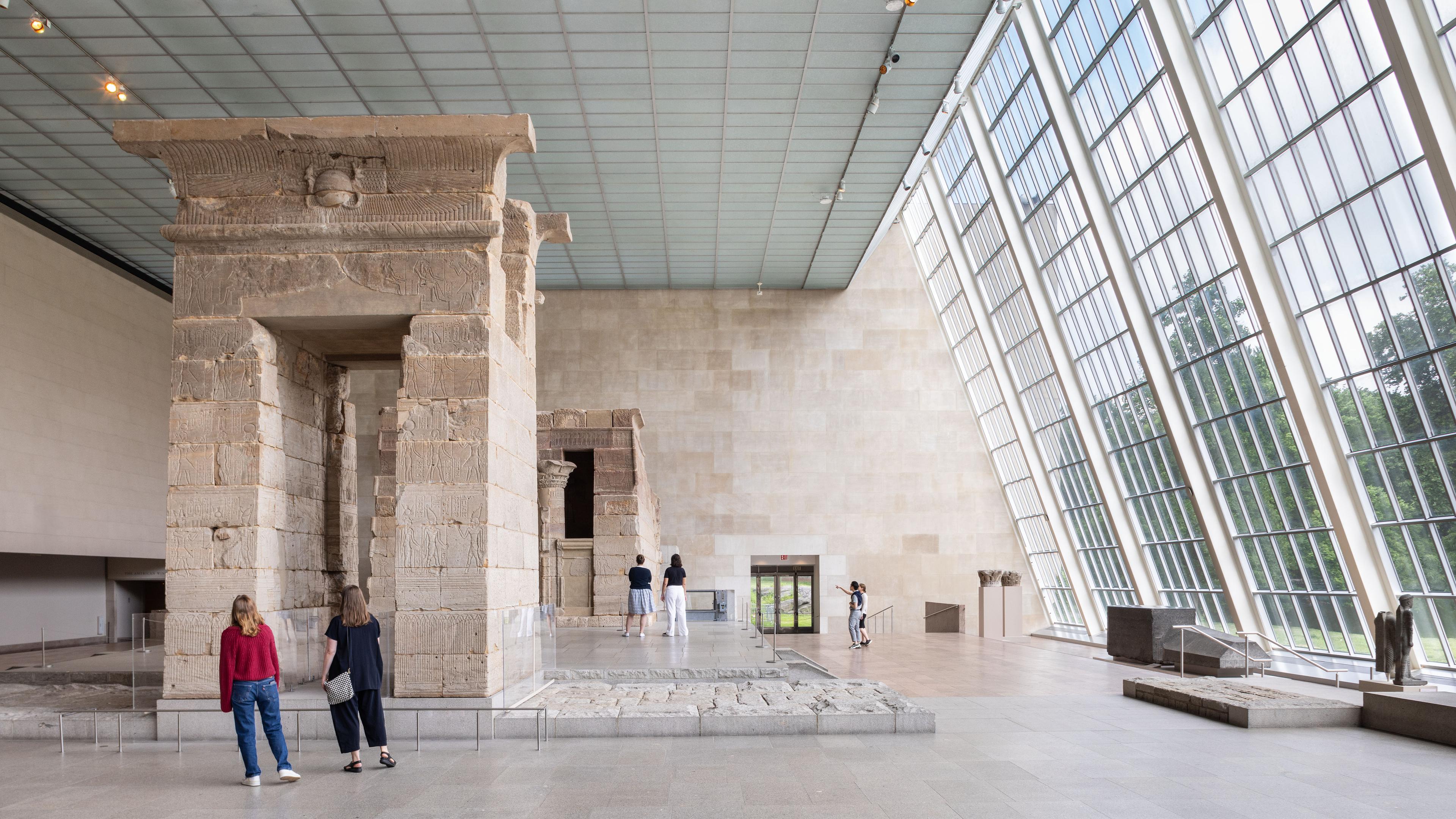 People explore The Temple of Dendur at The Met.