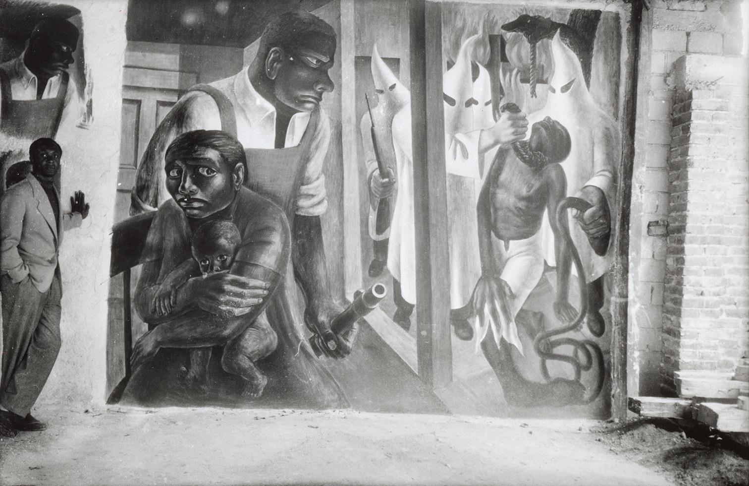 Black and white mural depicting oppression, with a man holding a child, anguished faces, and figures in hoods and robes.