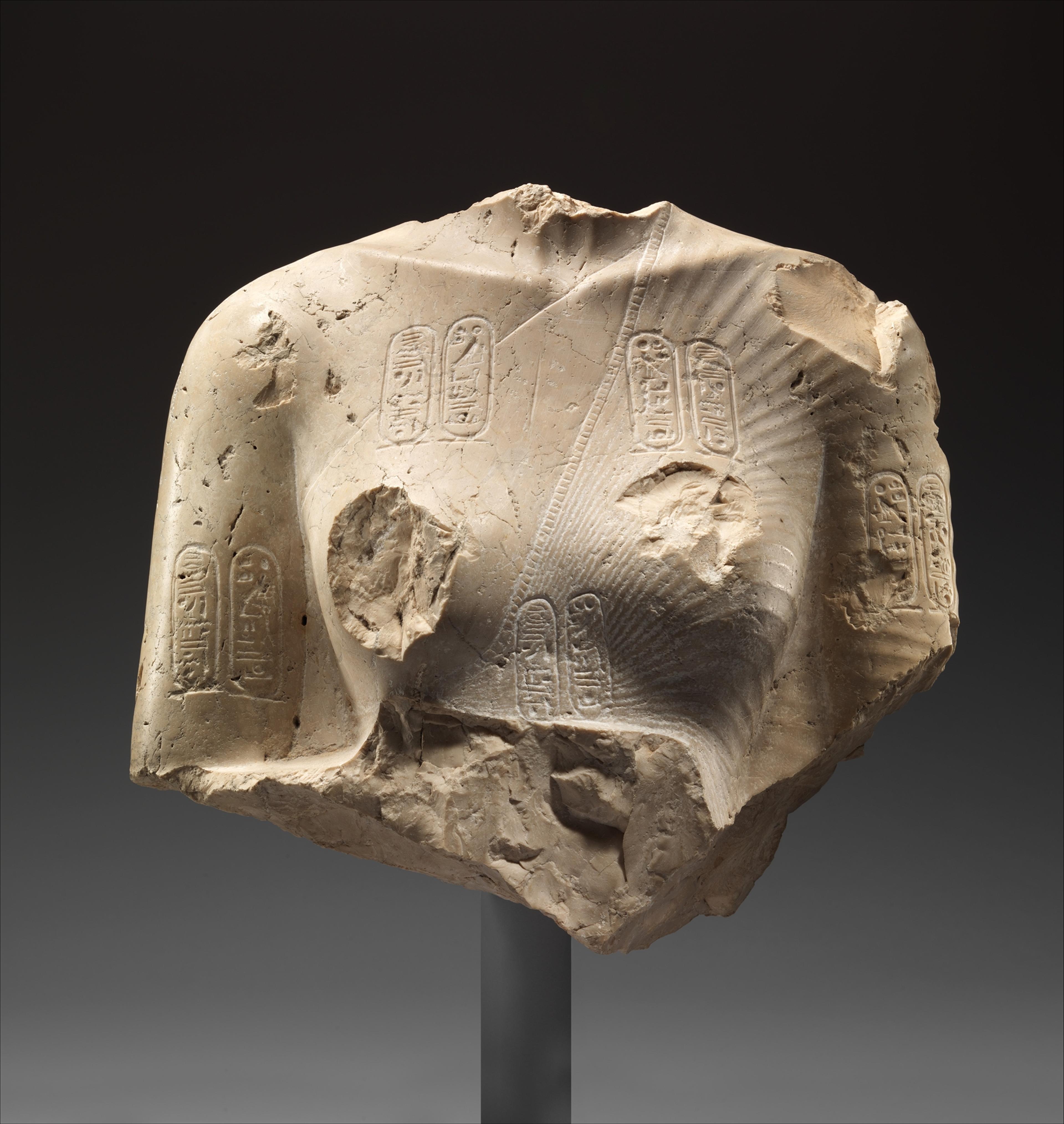 An Egyptian sculpture fragment of the torso of Nefertiti.