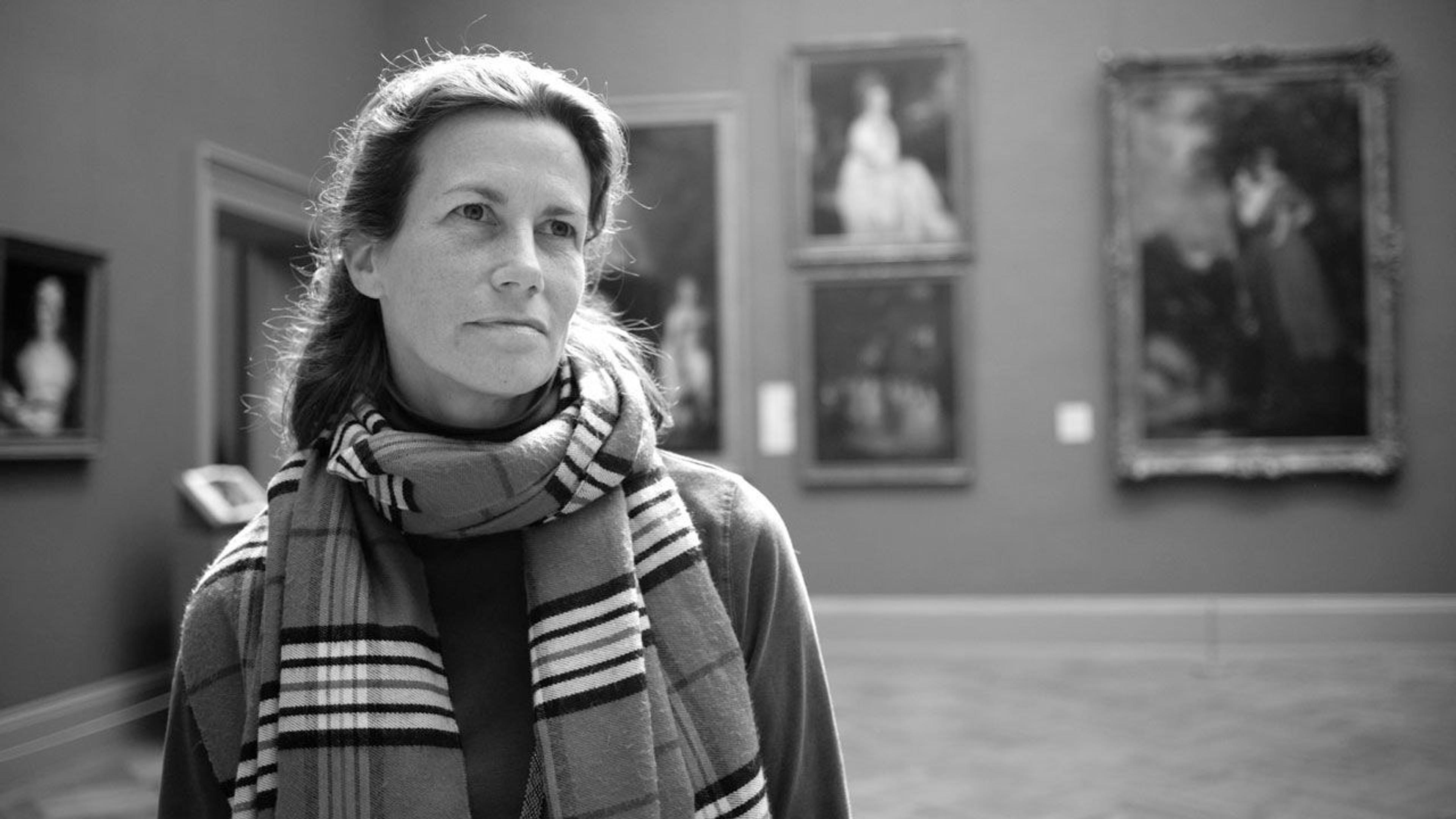 Black and white photograph of educator Alice Schwarz in The Met galleries