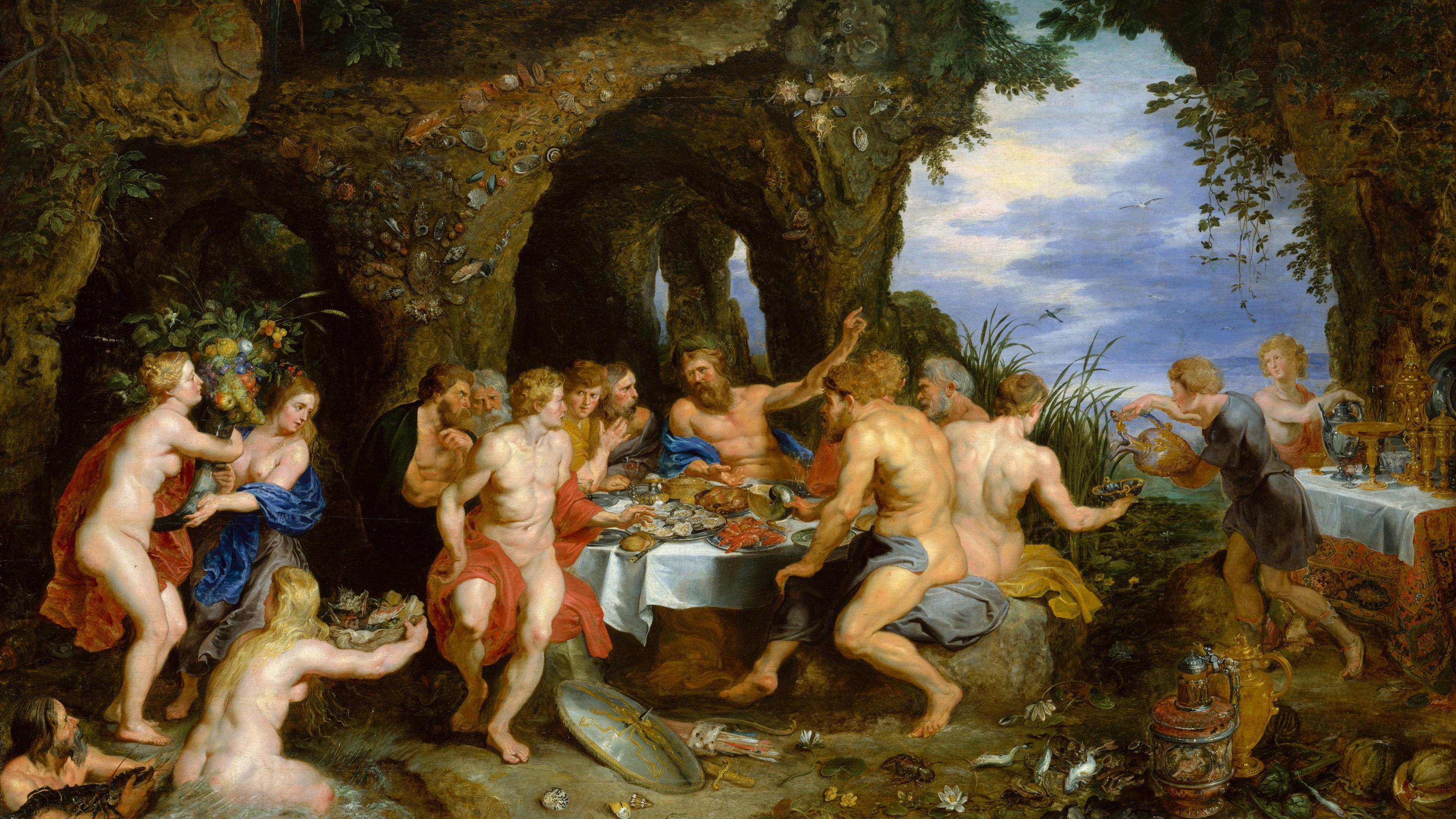 A fantastical scene of nude figures at a feast in a cave-like setting. The man at center points towards the water and sky in the opening behind him.