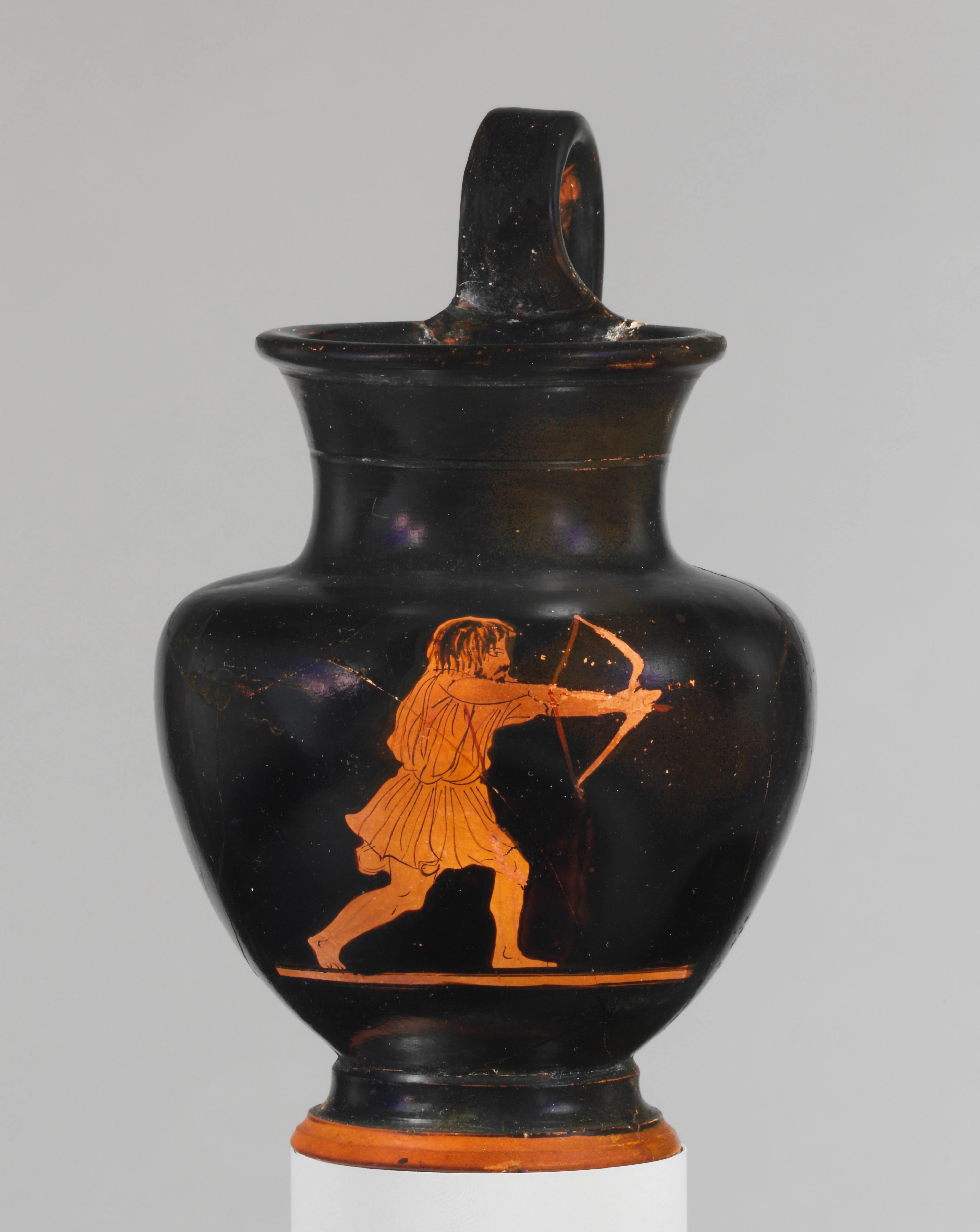 Black jug adorned with a red-figured man with long hair and wearing a tunic, drawing an arrow from a lunge position.