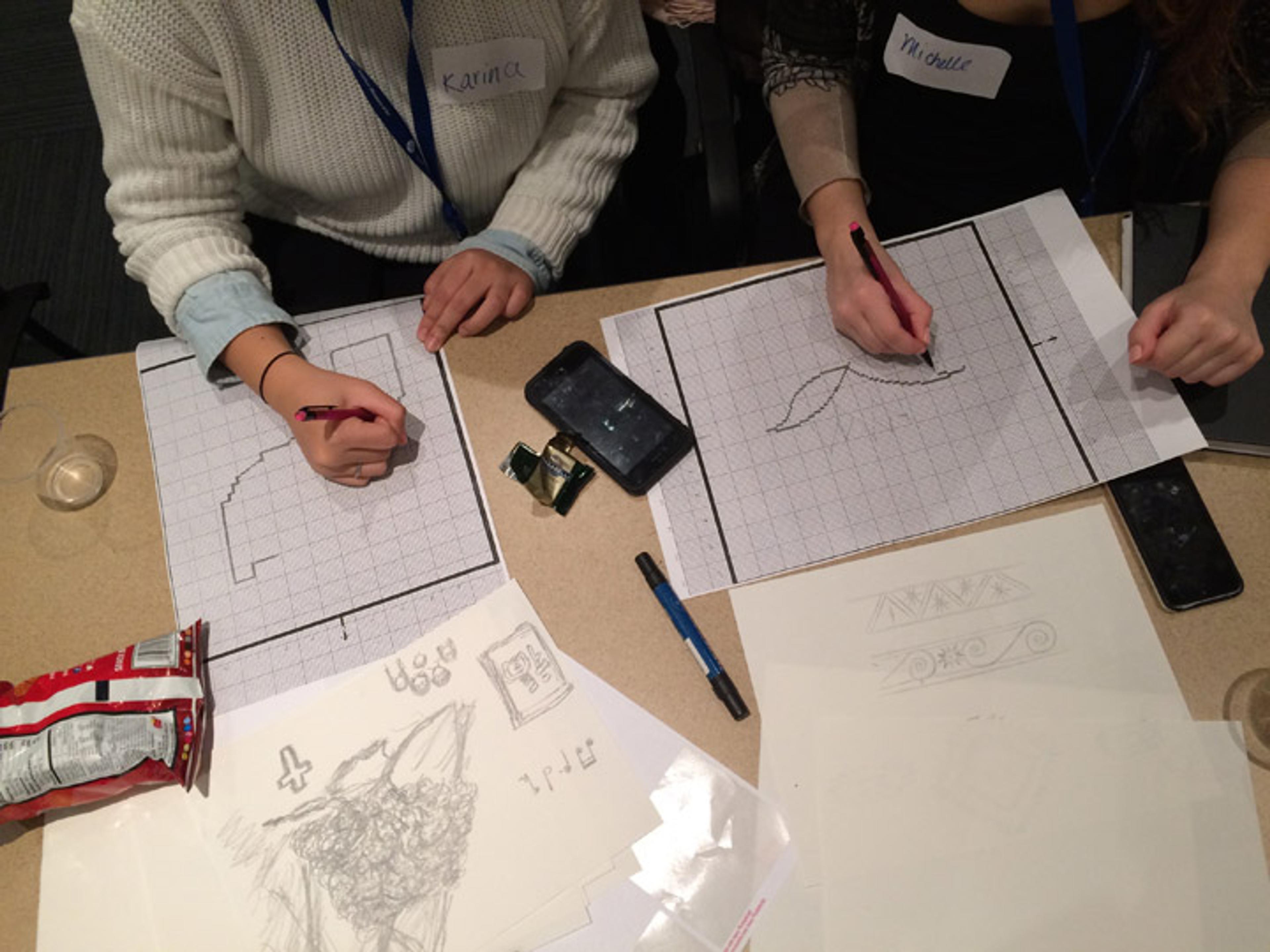 Teens mapping out their graphs for the rugs