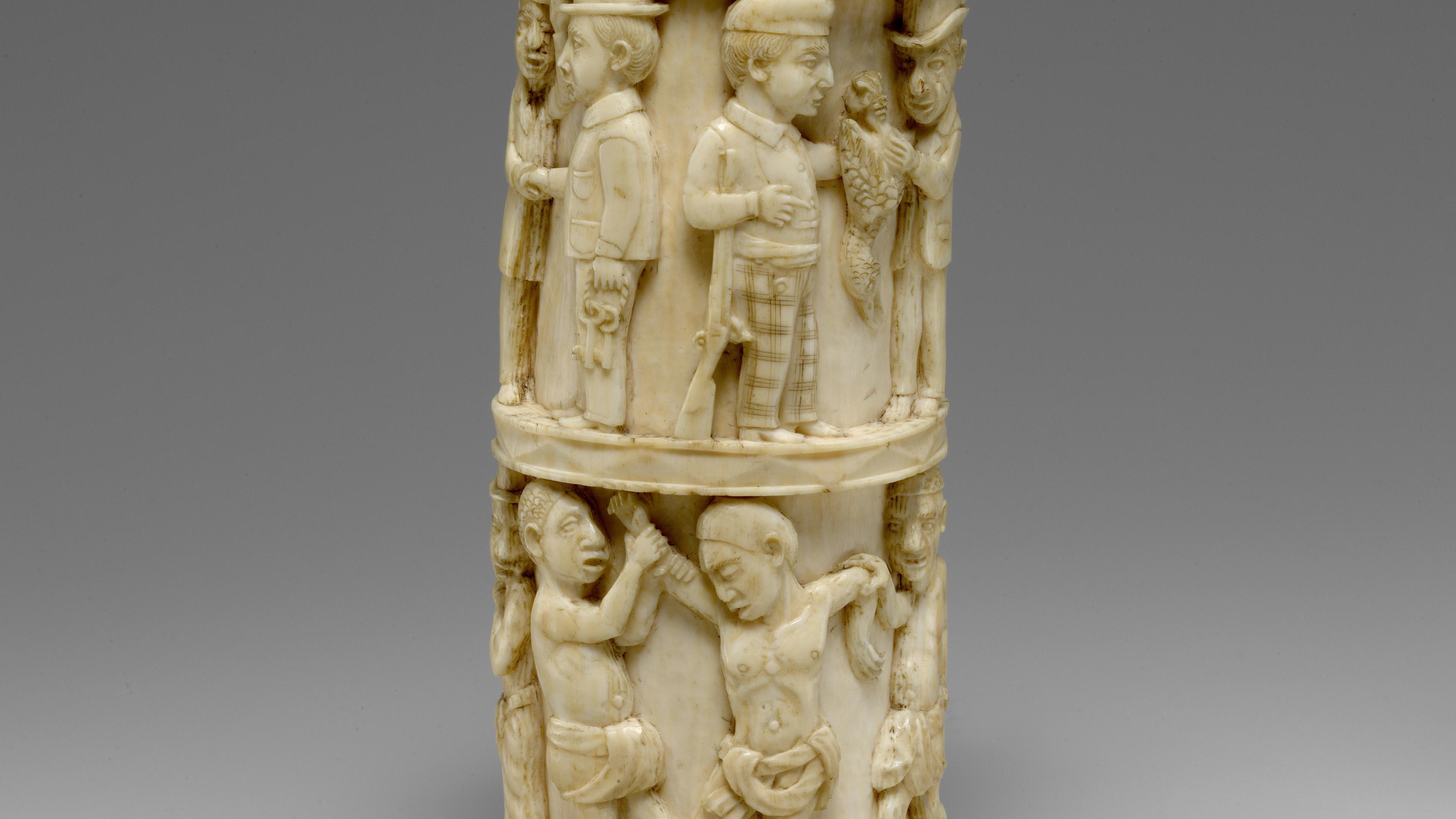 Male figures carved in relief around the surface of an ivory container