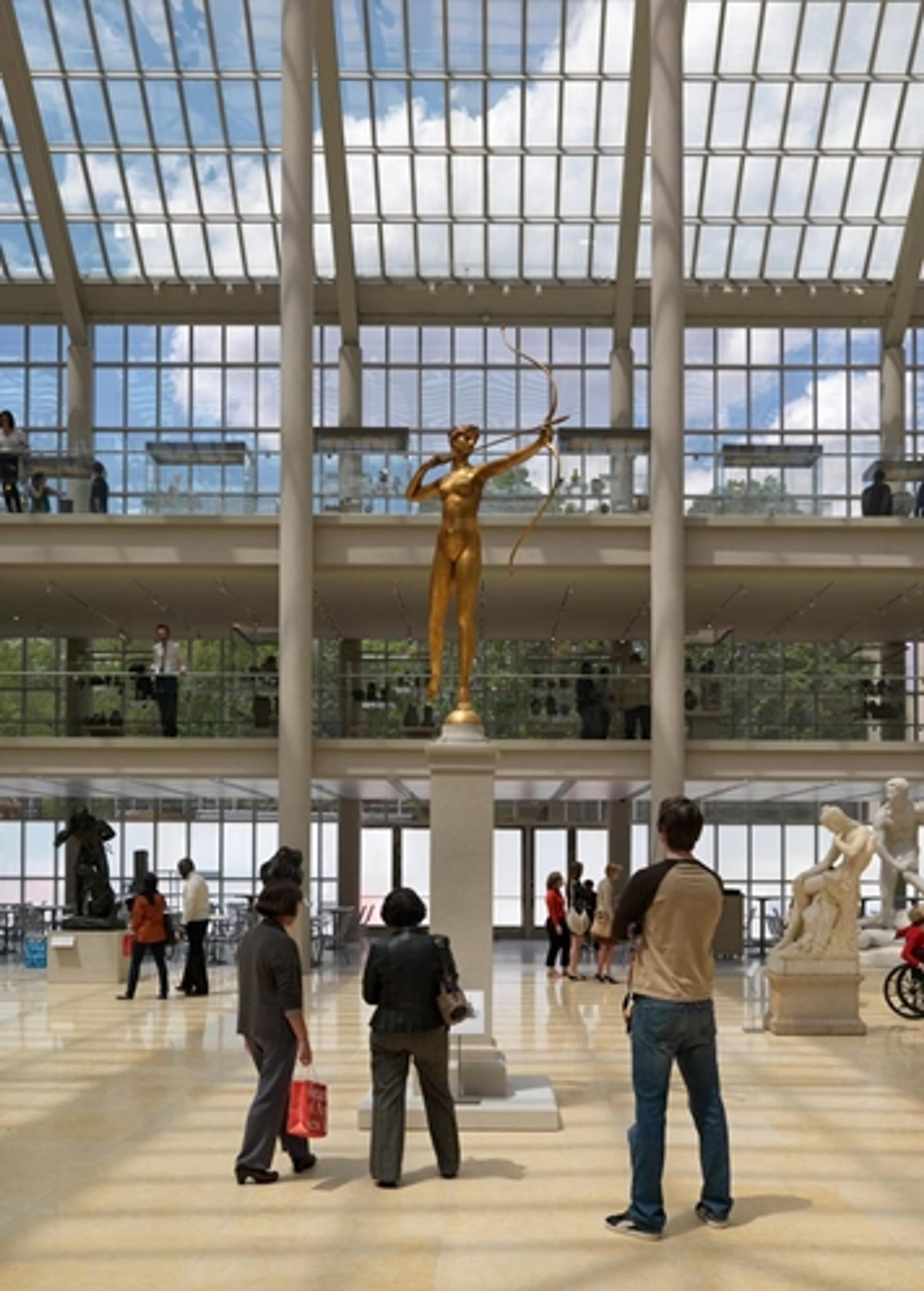 A group of visitors look at a sculpture in The Met's American Wing
