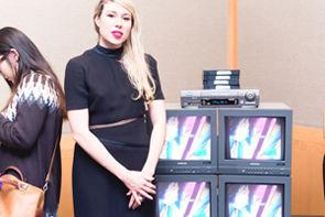 Joselyn in front of FEMET on display at the Met Media Lab Expo