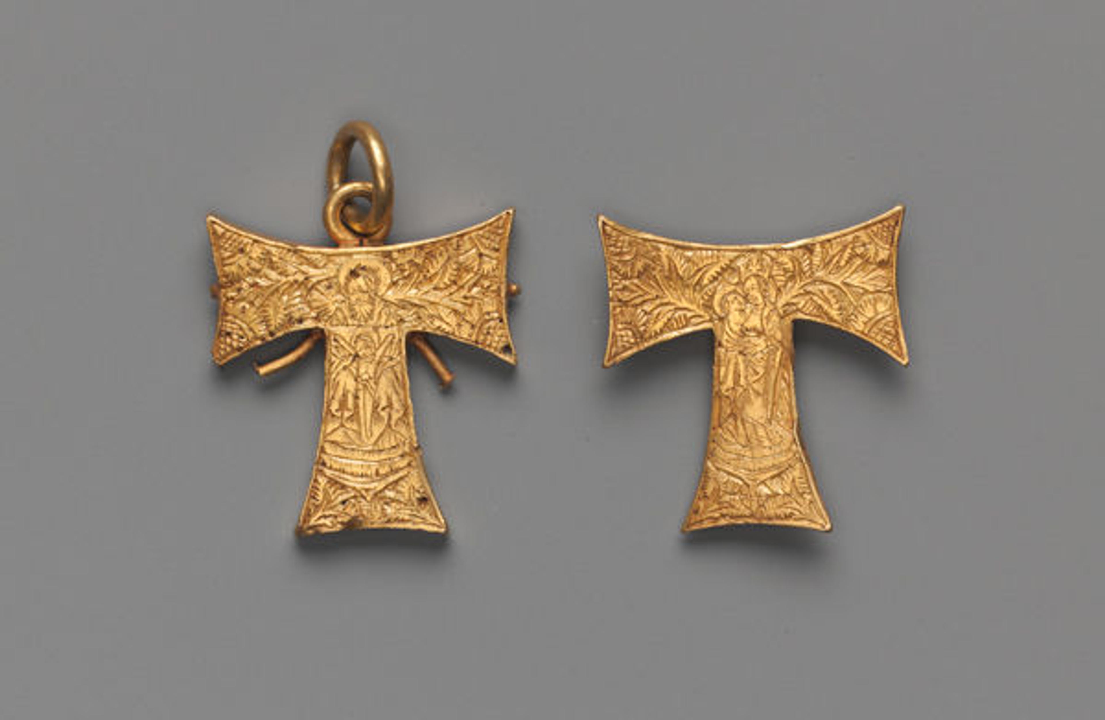 Pendant in the form of a tau cross, with the Trinity and the Virgin and Child (front and back), ca. 1485. British. Cast and engraved gold; H. 1 1/8 in. (2.8 cm). The Metropolitan Museum of Art, New York, The Cloisters Collection, 1990 (1990.283)