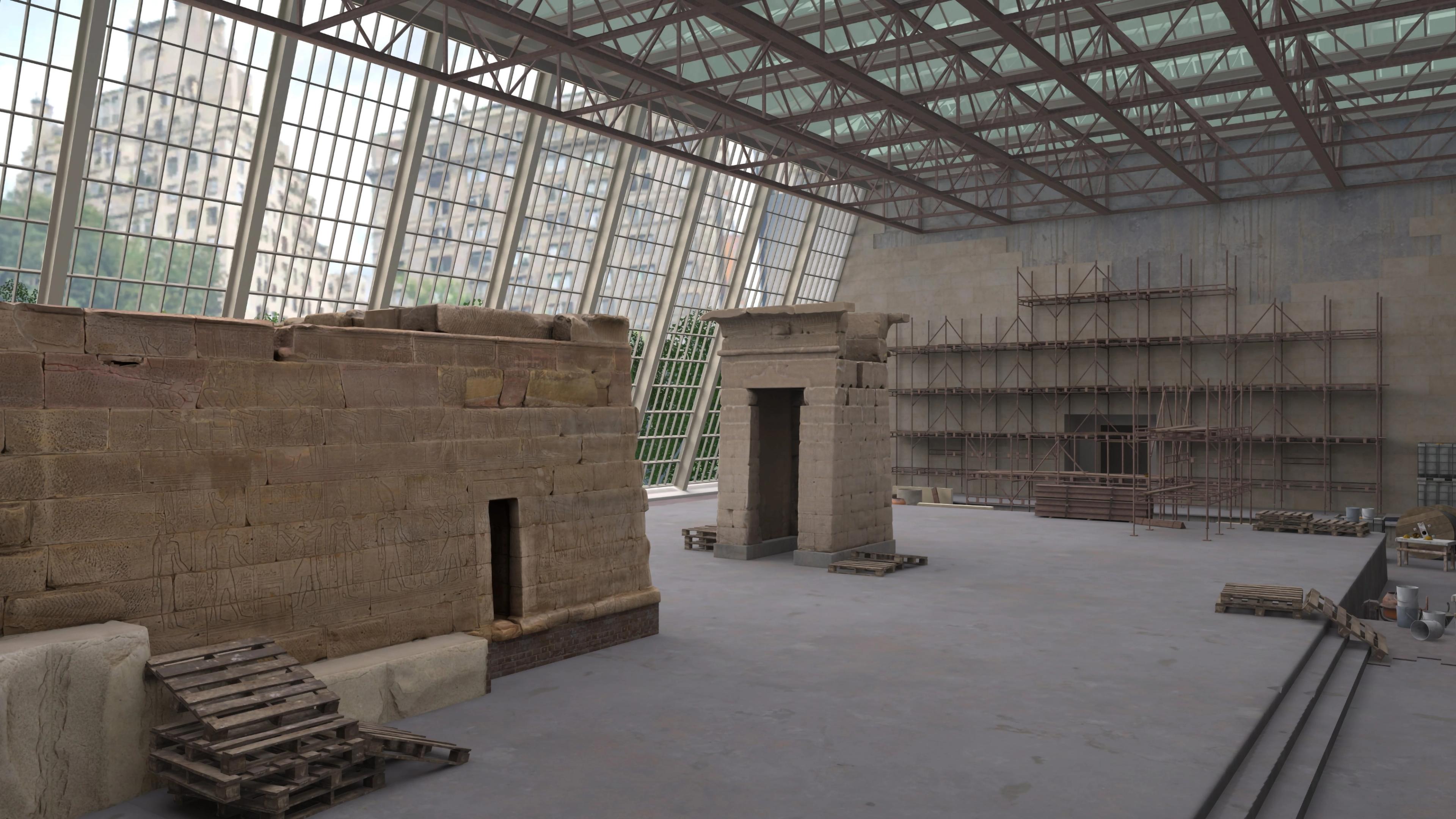 Stone building fragments in a large gallery space with a wall and ceiling of paneled windows. The space appears to be under construction, with scaffolding and pallet crates throughout the scene.