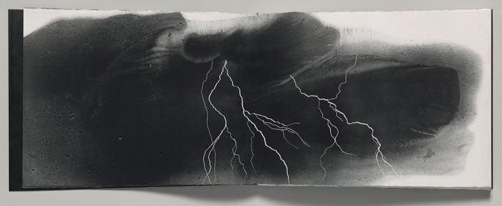 Page spread from Ranjani Shettar's artist book 'Varsha' depicting an ominously dark sky and lightning strikes