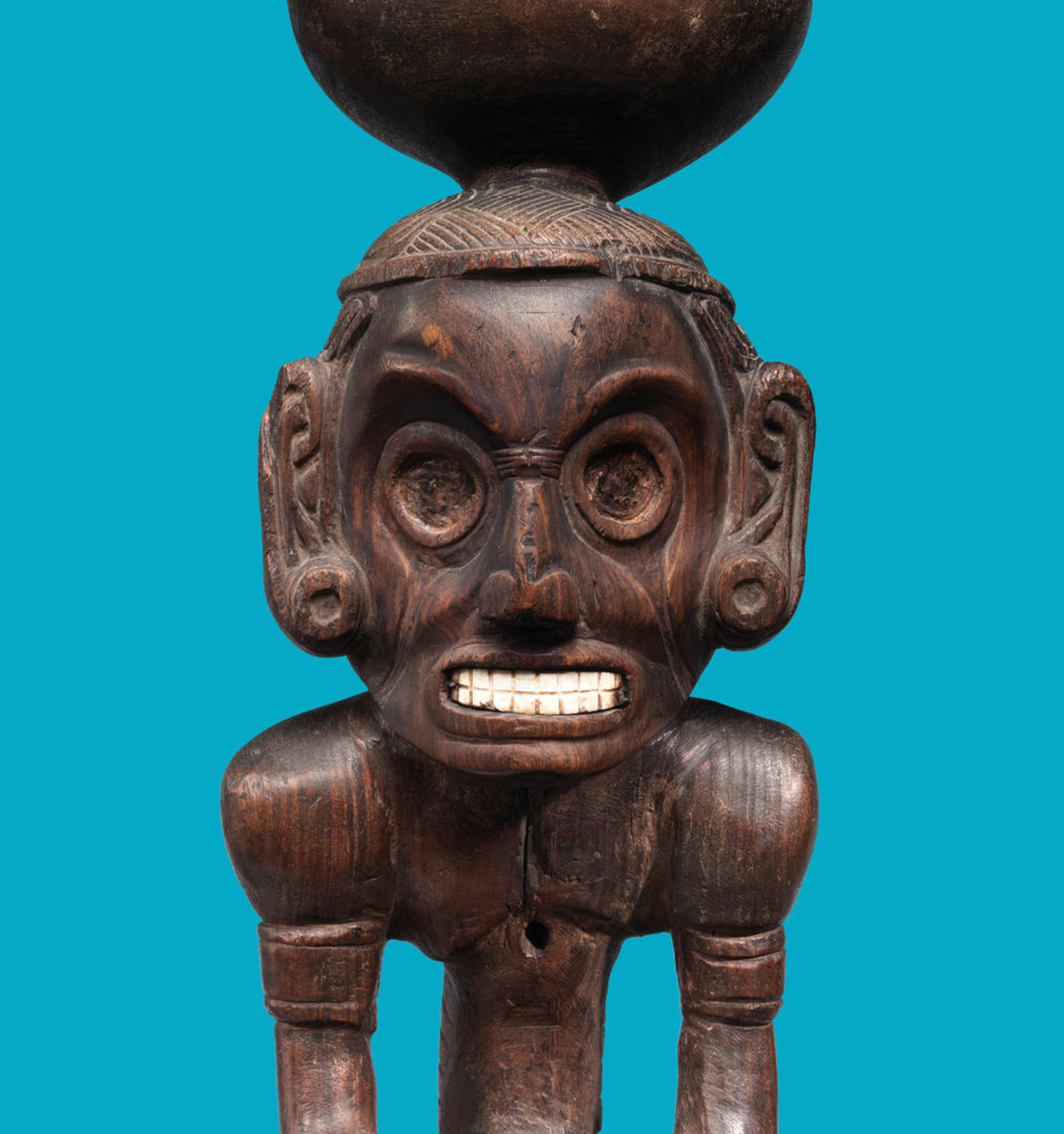 Color image of a wooden anthropomorphic deity figure (zemí) made in the Dominican Republic ca. AD 1000