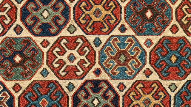 Detail of colorful woven sumak pattern on a double saddle bag from Iran.