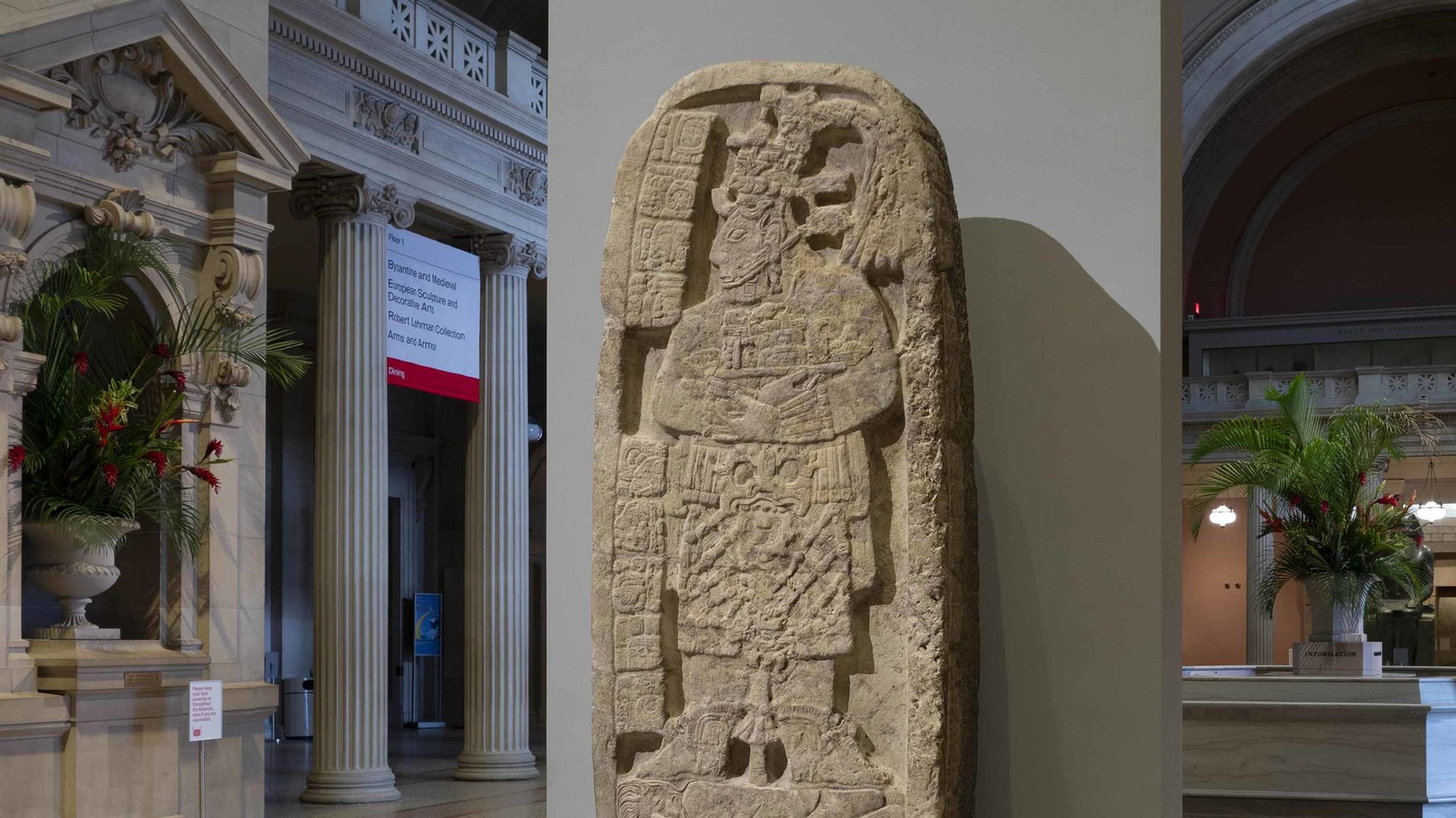 Portrait of a queen regent trampling a captive carved into a stelae, or large decorated stone slab, of Maya origin. The sculpture is installed in the Great Hall at the Museum.
