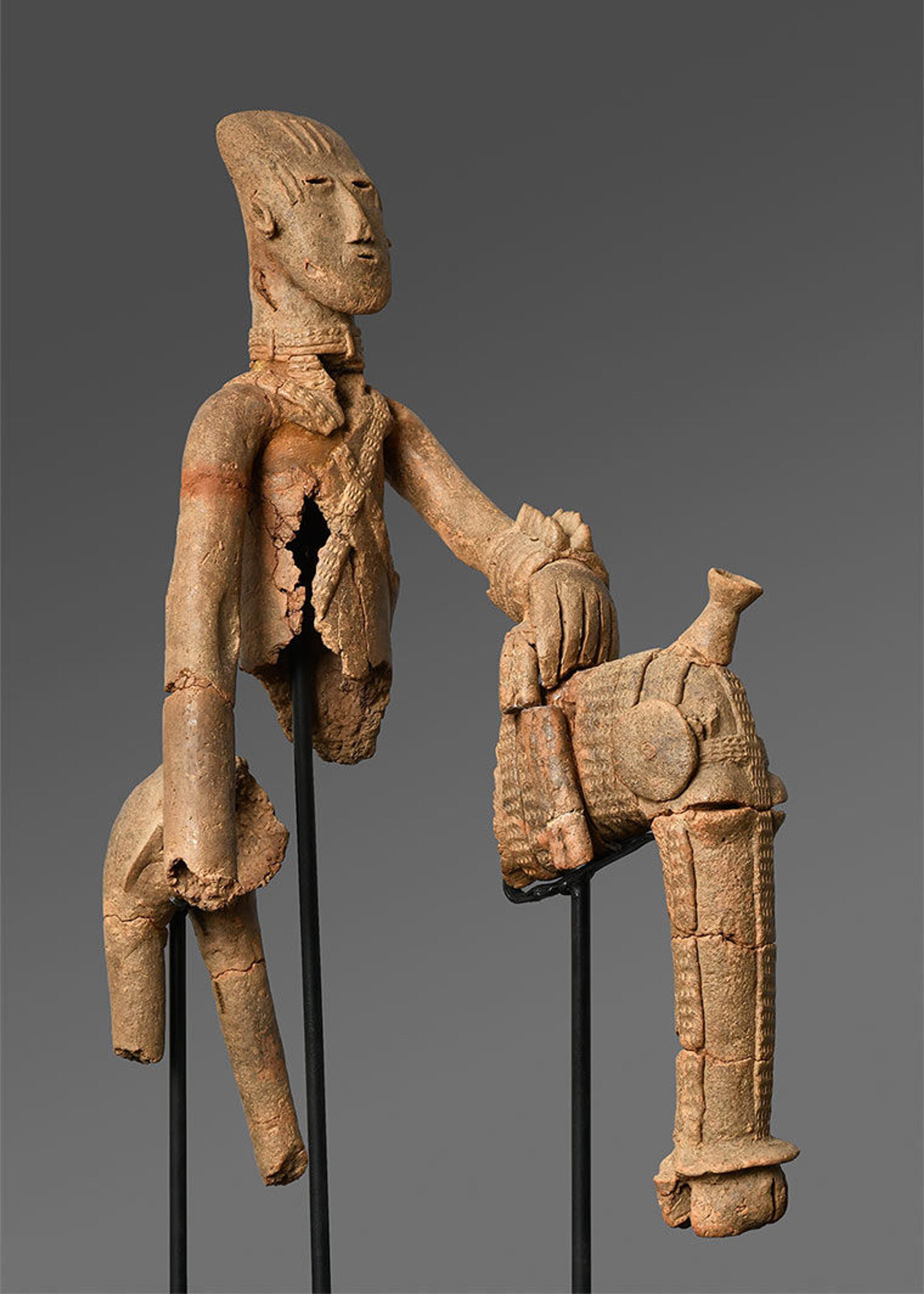 A terracotta equestrian figure